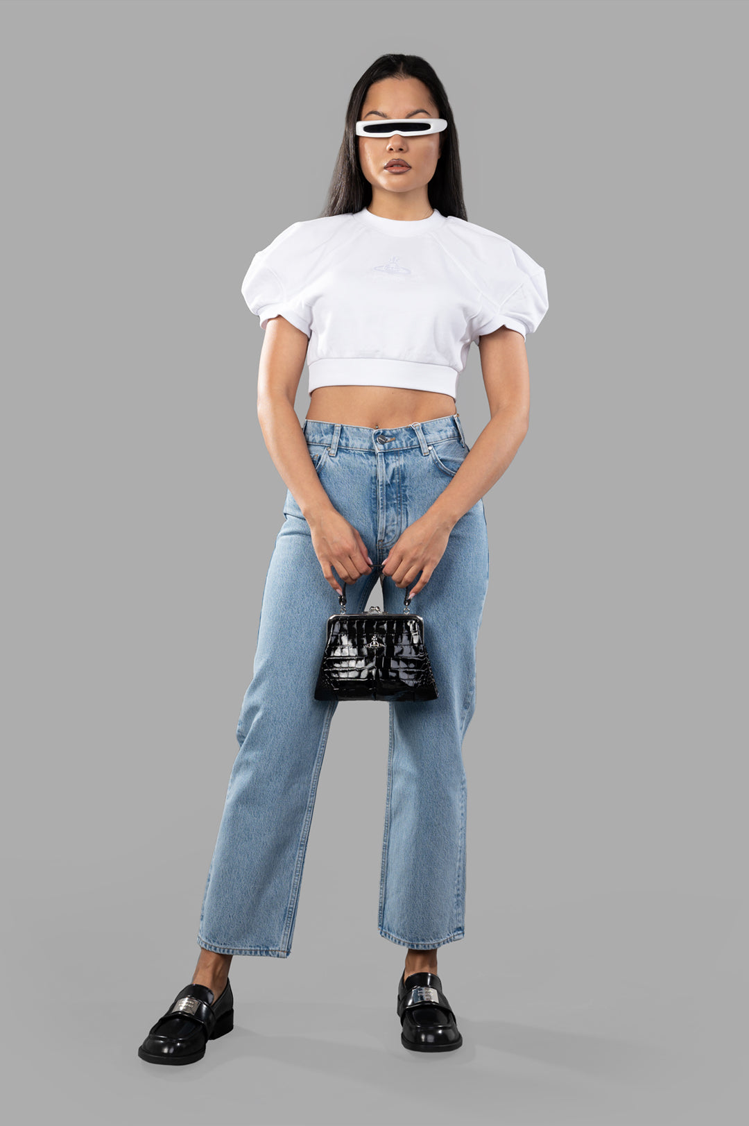 Vivienne Westwood Cropped Football Sweatshirt in white, voluminous shoulders, on-model view, paired with jeans and accessories.