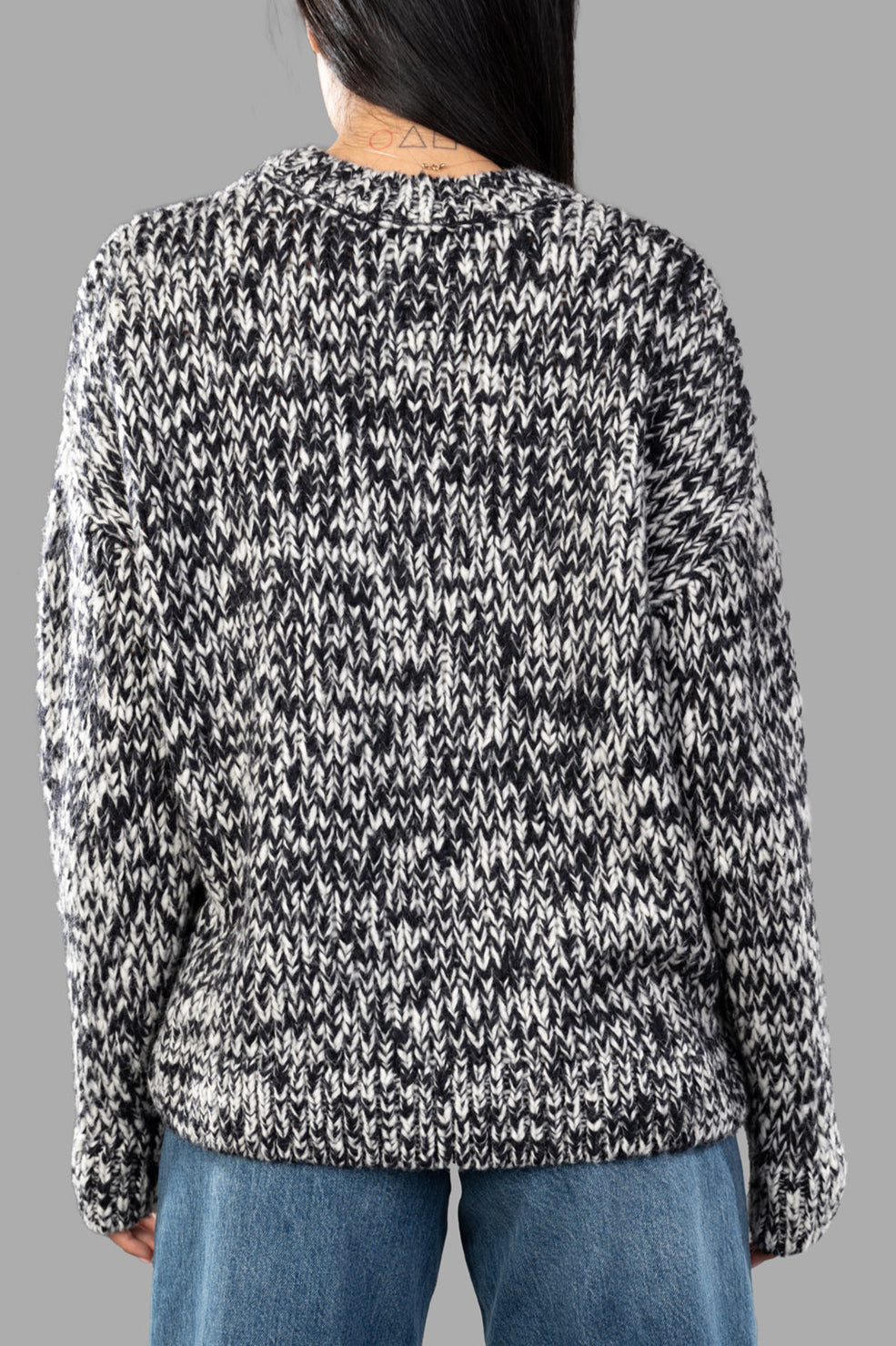 Anine Bing Melange Sweater in black/white, featuring a cozy back detail and long sleeves for a stylish, relaxed fit.