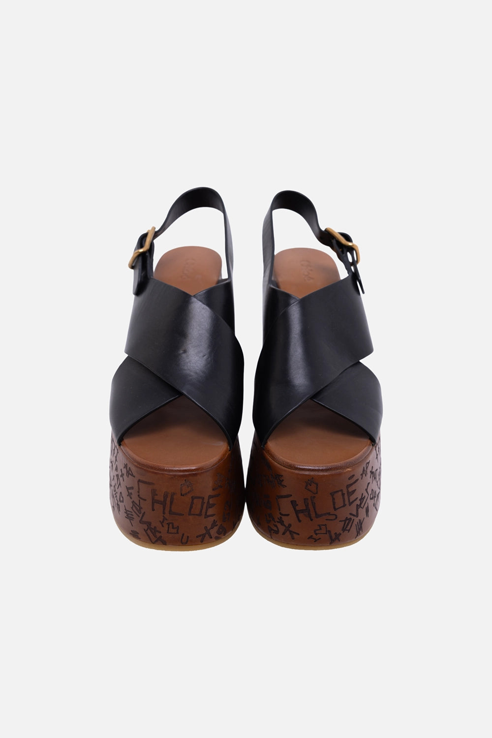 Pre-owned Chloé women’s wedge sandals in black, front view, criss-cross leather straps and engraved platform base