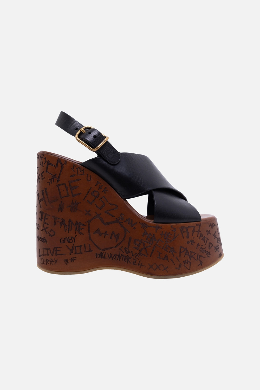 Pre-owned Chloé women’s wedge sandals in black, side view, engraved wooden platform and gold buckle strap