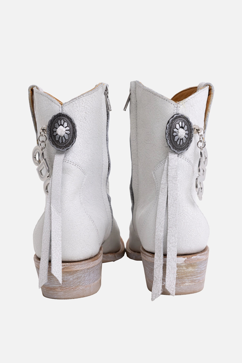 Comme des Garçons x Mexicana women's western ankle boots in white, back view with zipper pulls, conchos and charms