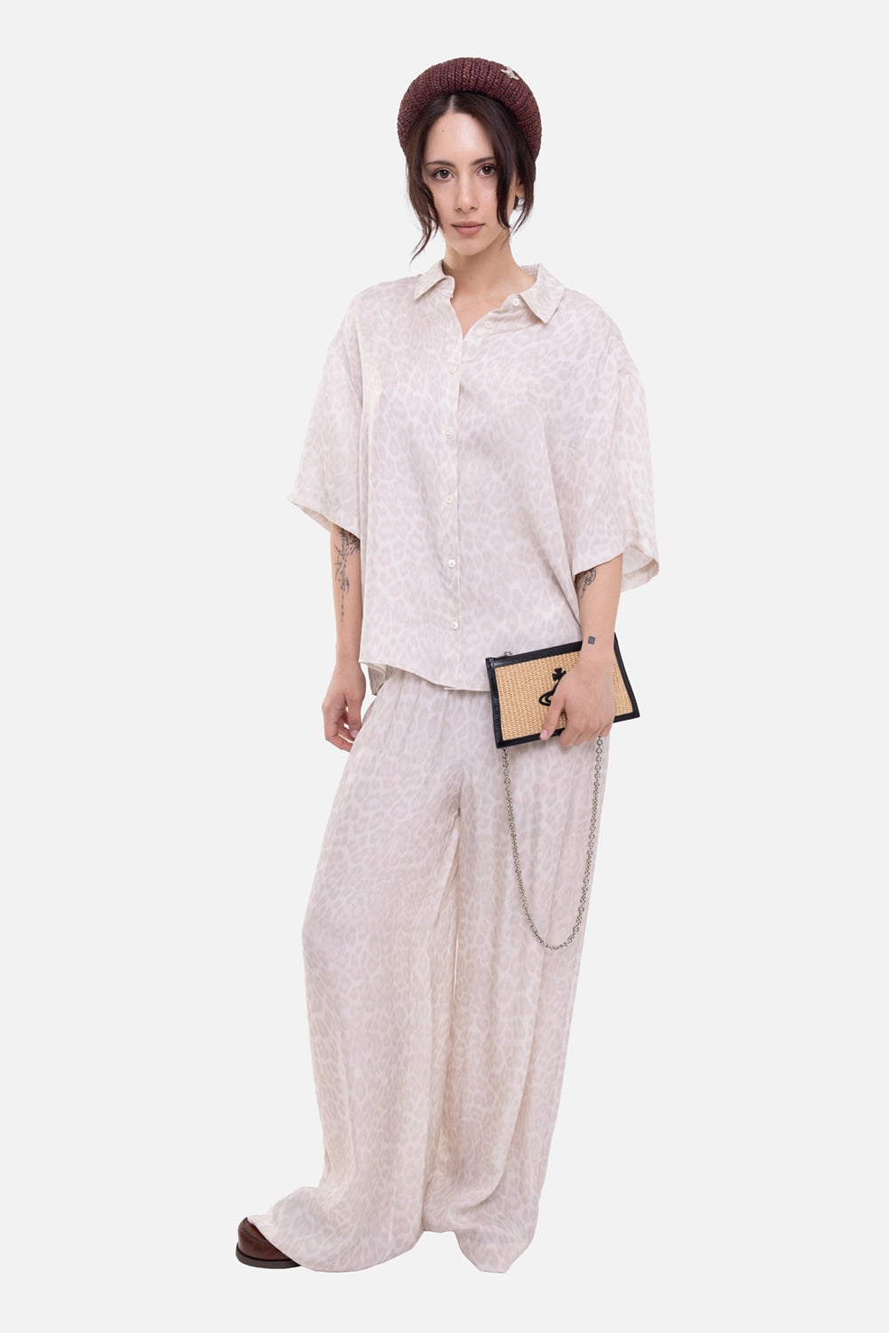 Anine Bing women's wide-leg pants in washed white leopard, on-model full-length view, fluid printed leg