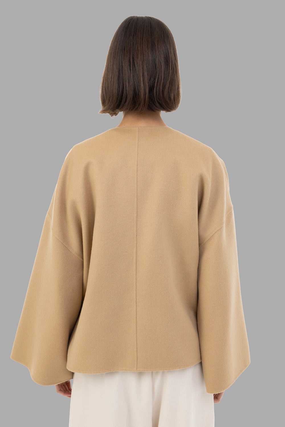 By Malene Birger women's wool jacket in Dark Sand, back view, dropped shoulders and curved hem