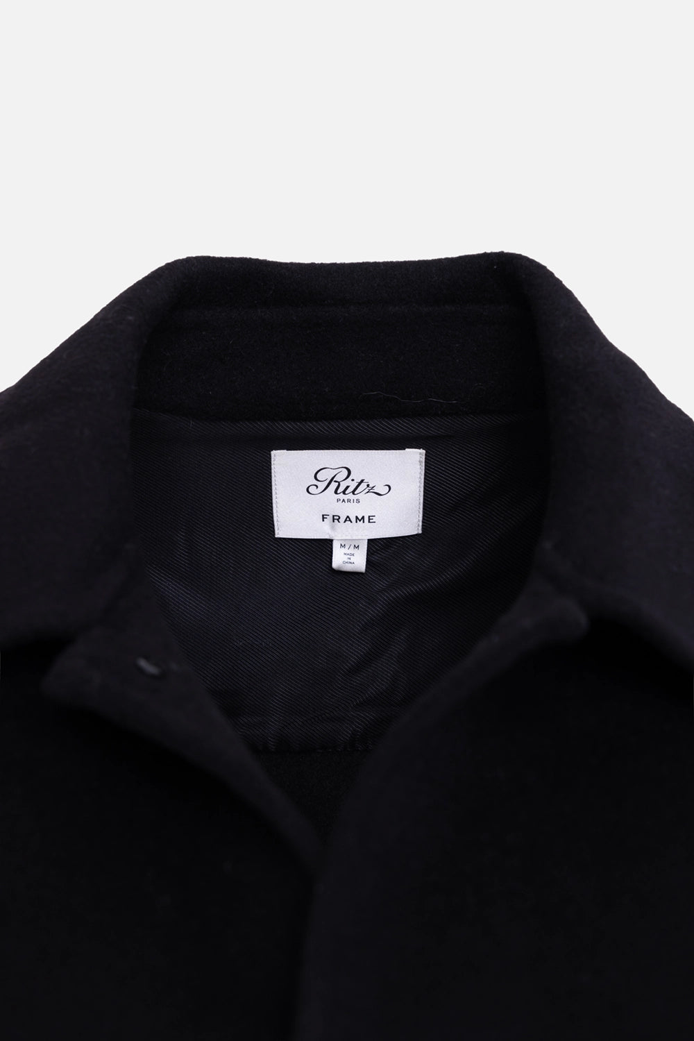 Pre-owned FRAME x Ritz Paris wool shirt jacket in black, label close-up, woven neck label