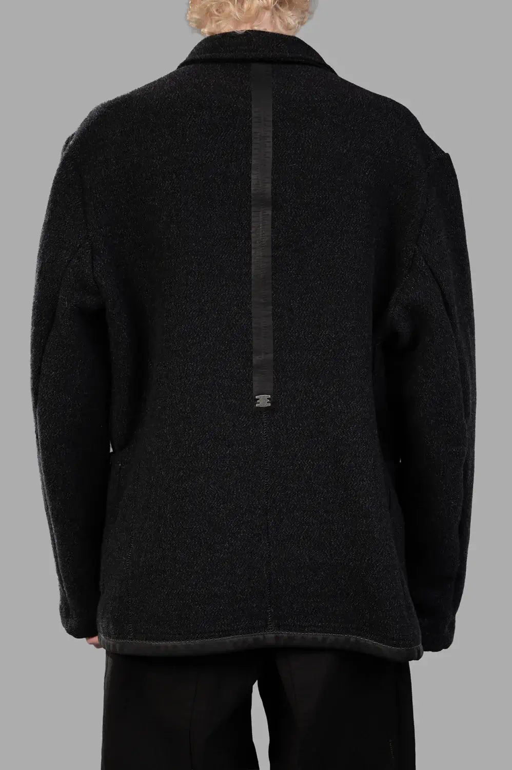 69 by Isaac Sellam worker jacket in Unique, back view, long leather spine with staple detail