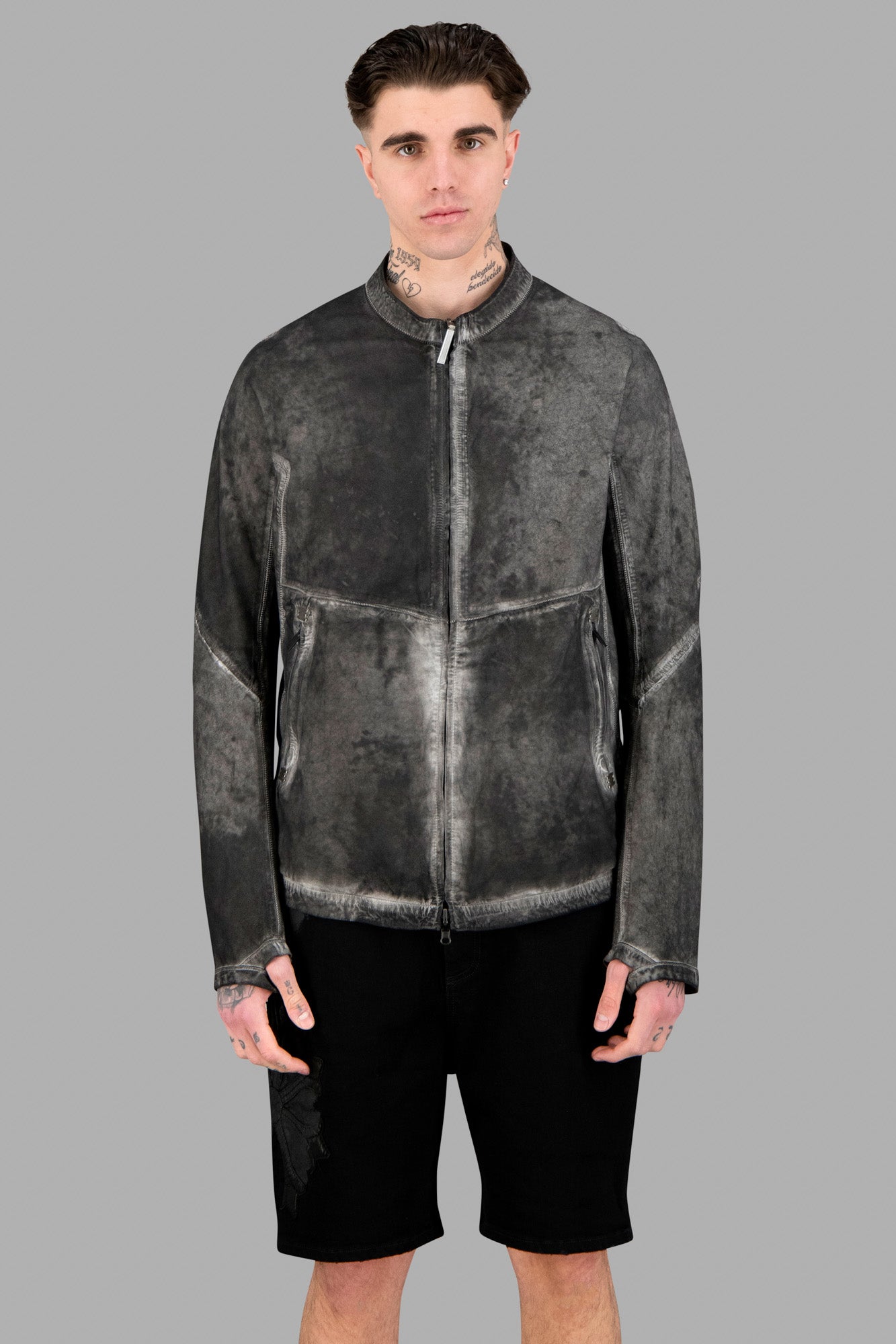 Isaac Sellam Reversible Leather Jacket worn by model, showcasing round collar, zip-up front, and unique plomb color texture.