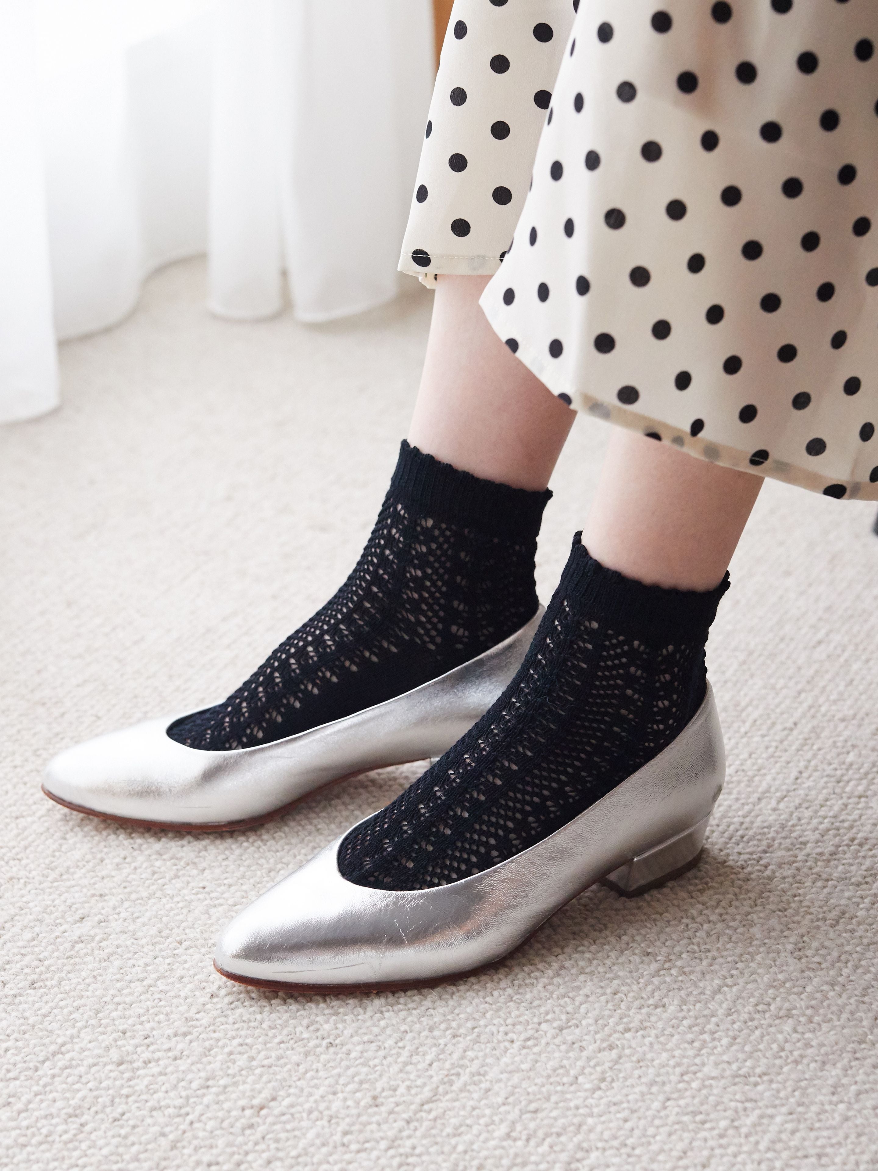 Tabio Irmack Mesh Ankle Socks displayed on model, featuring classic lace pattern in black, paired with silver heels.