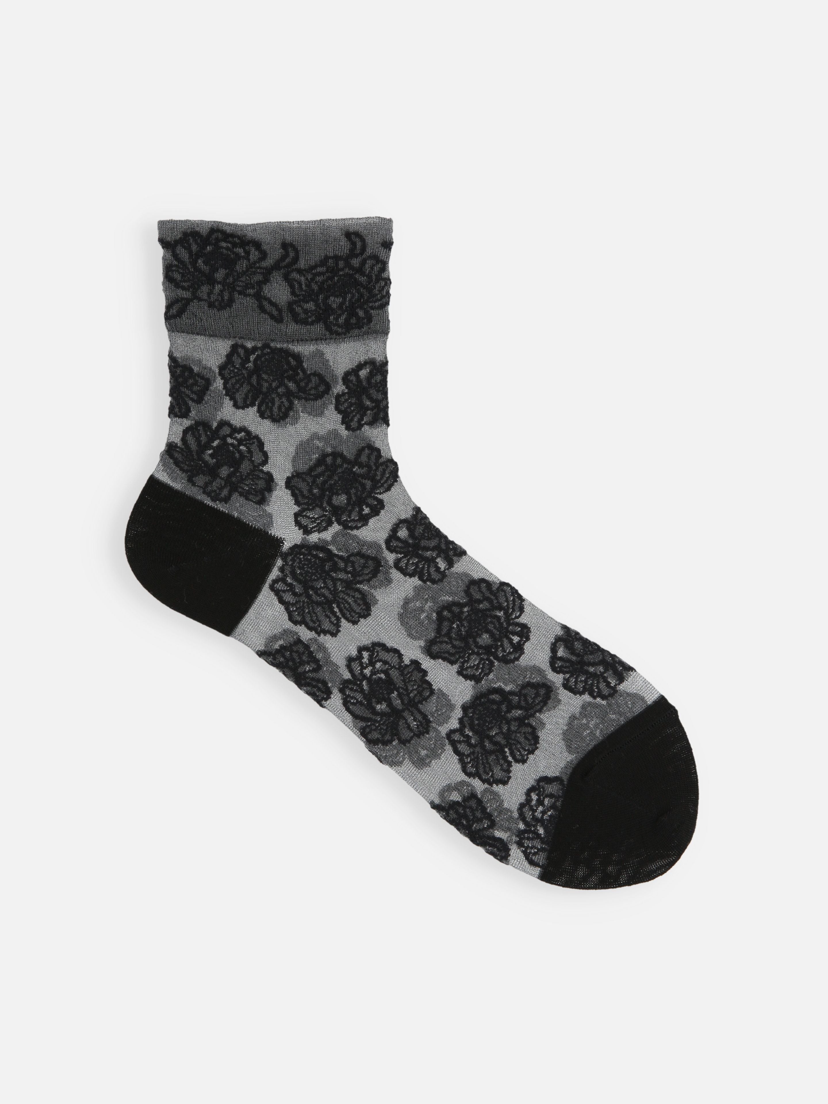 Tabio Tulle Peony Low Crew Socks in black and white, showcasing line-drawn peony pattern and soft elastic detail.