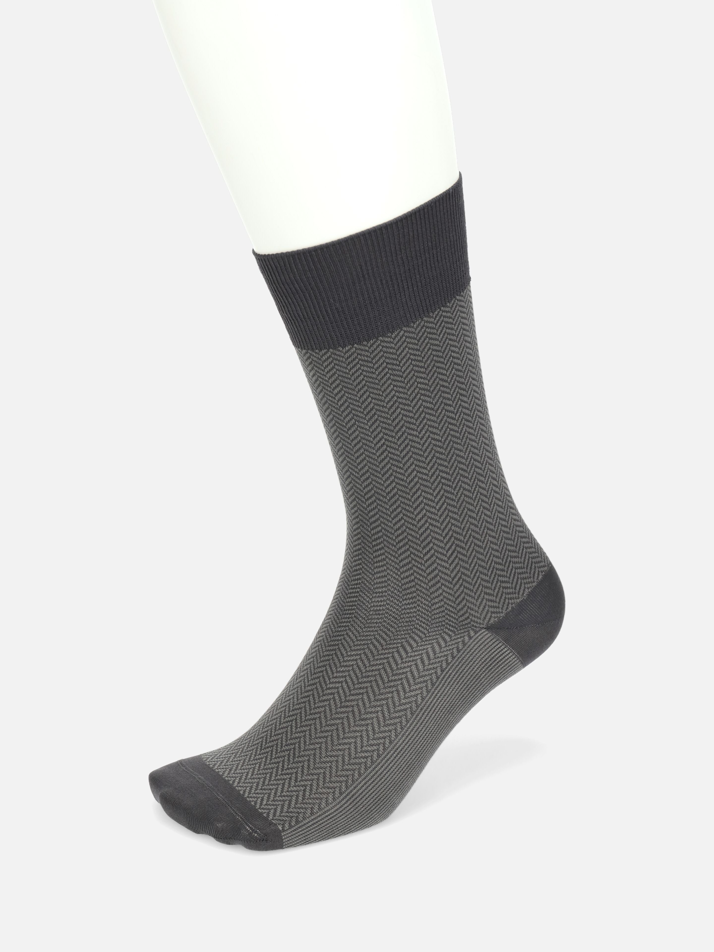 Tabio Herringbone Finest Supima Mid-Calf Socks in black and grey showcase a jacquard pattern, perfect for formal attire.