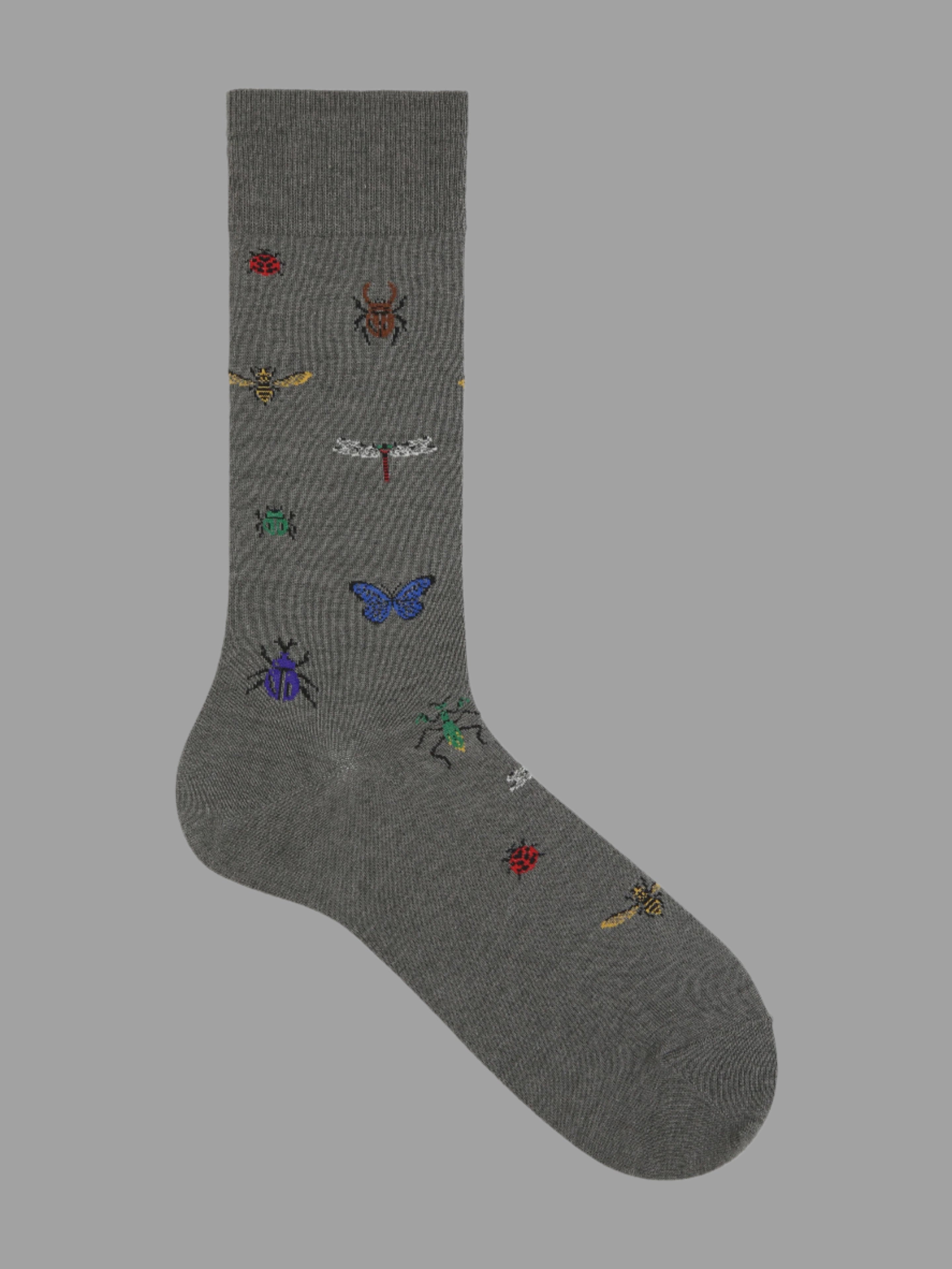 Tabio. Dragonfly-Pattern Crew Socks featuring an elegant dragonfly design in grey, perfect for stylish casual or professional wear.