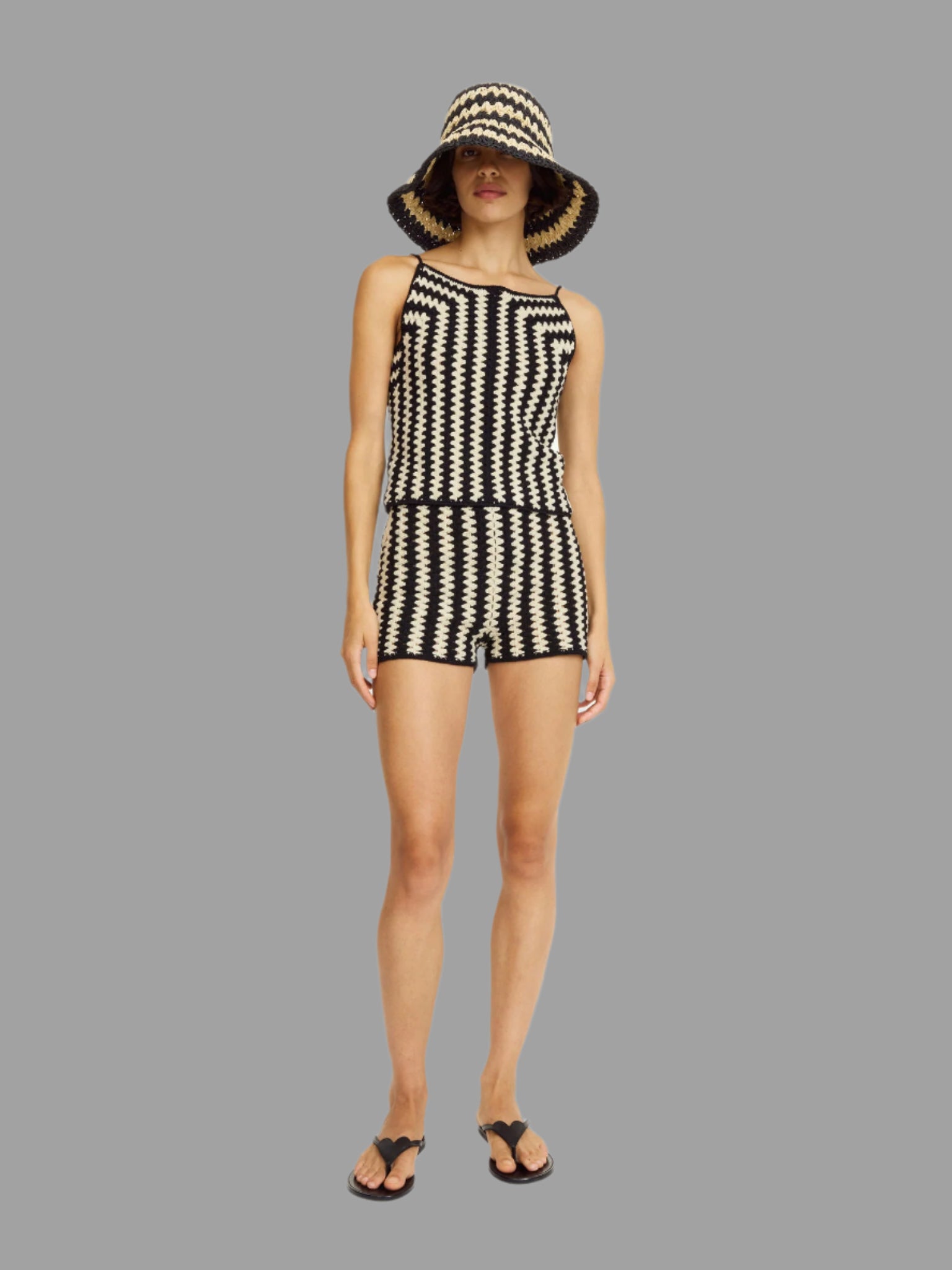 By Malene Birger Dor Organic Cotton Shorts, model wears black and white crochet design, front view with similar top and hat.