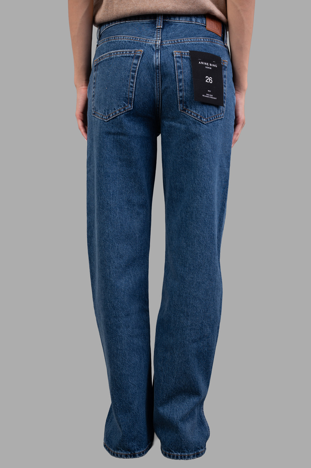 Anine Bing Roy Jeans featuring a clean blue wash, shown from the back with visible label and midweight cotton texture.