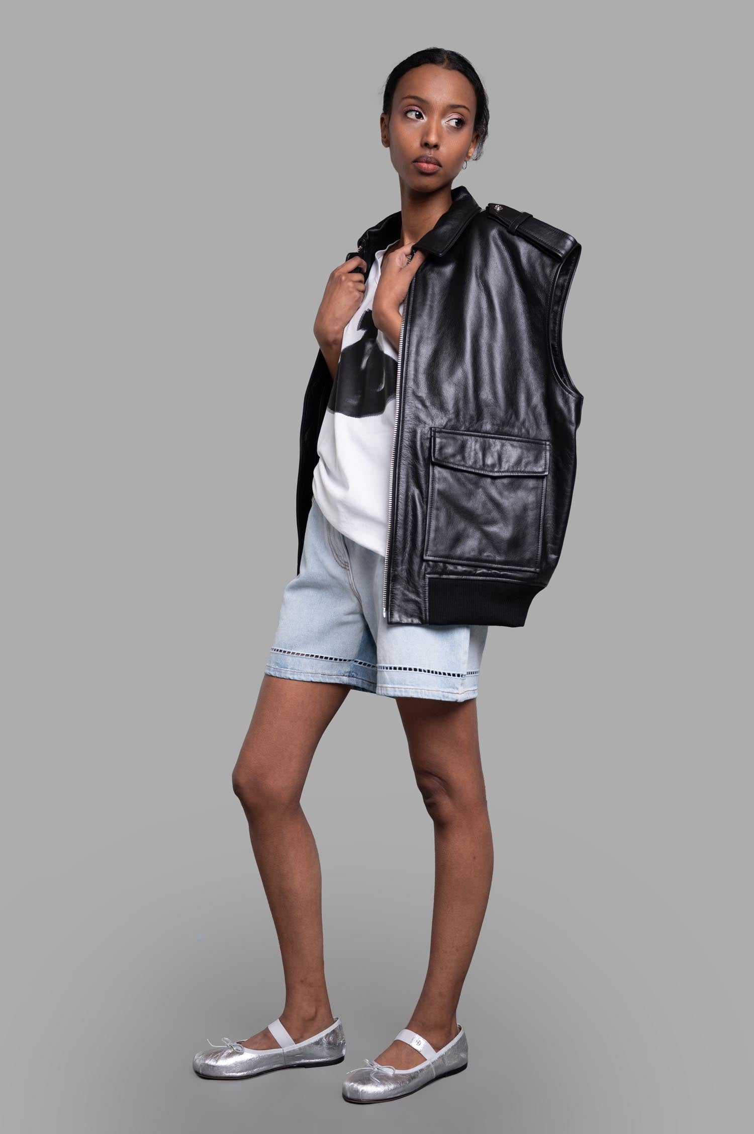MSGM Perforated Denim Shorts in light blue, shown on model, featuring broderie anglaise hem and contrast stitching.