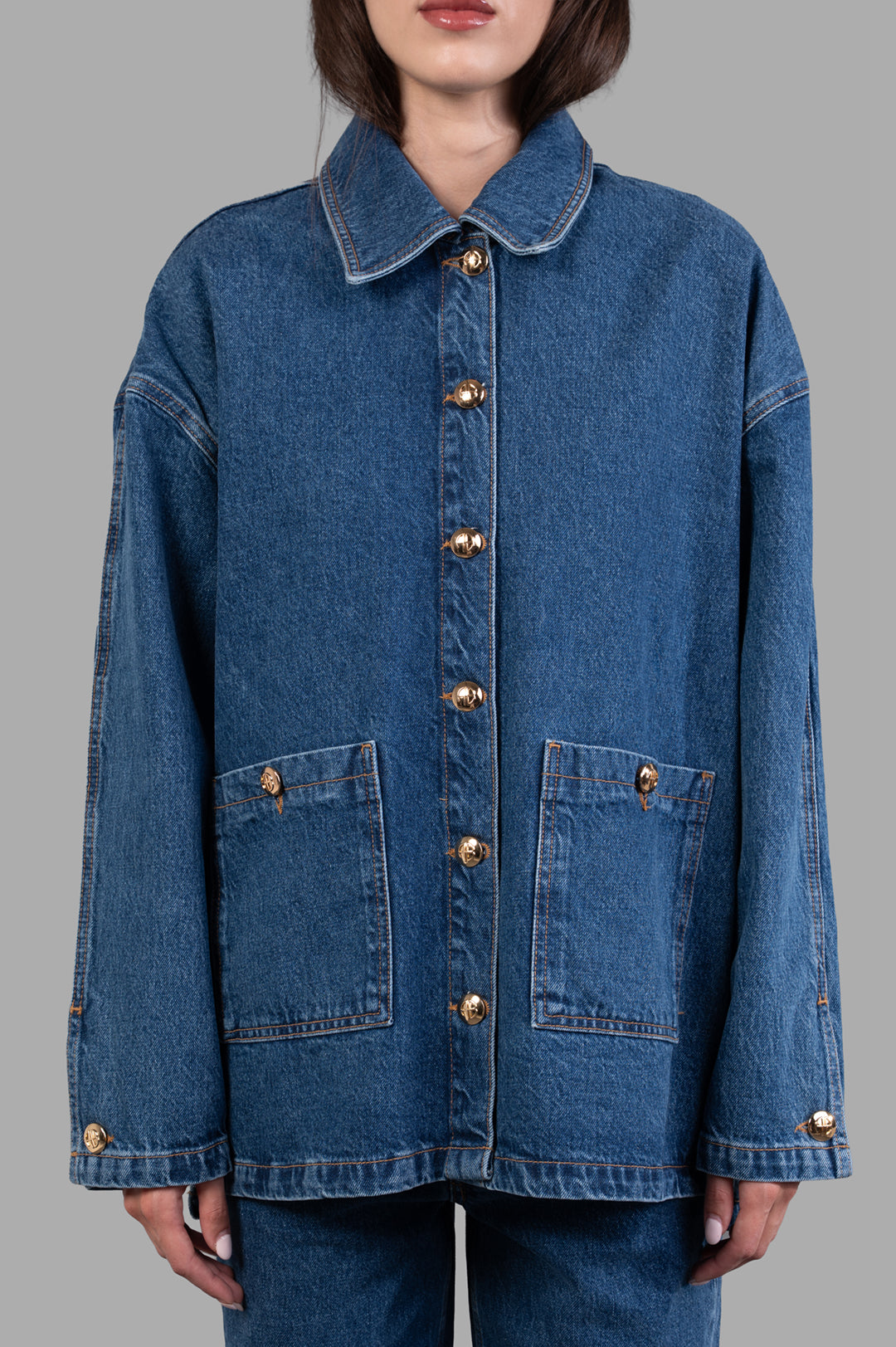 Anine Bing Luca Jacket features a buttoned front, oversized fit, and two pockets in midweight regenerative cotton denim.
