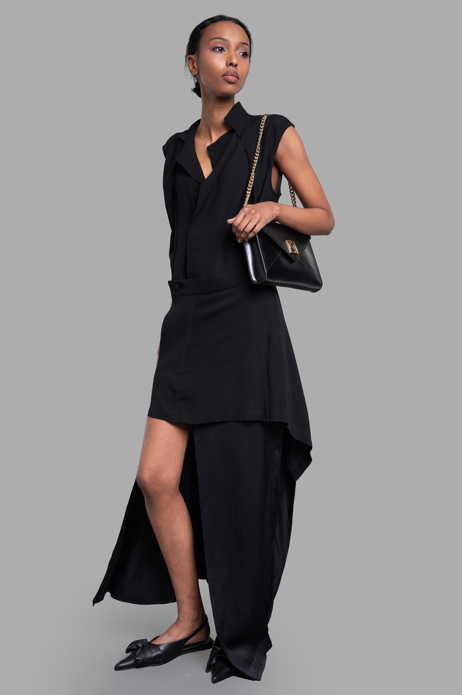Vivienne Westwood black layered dress, front view on model, asymmetrical design, V-neck, cap sleeves, viscose fabric.