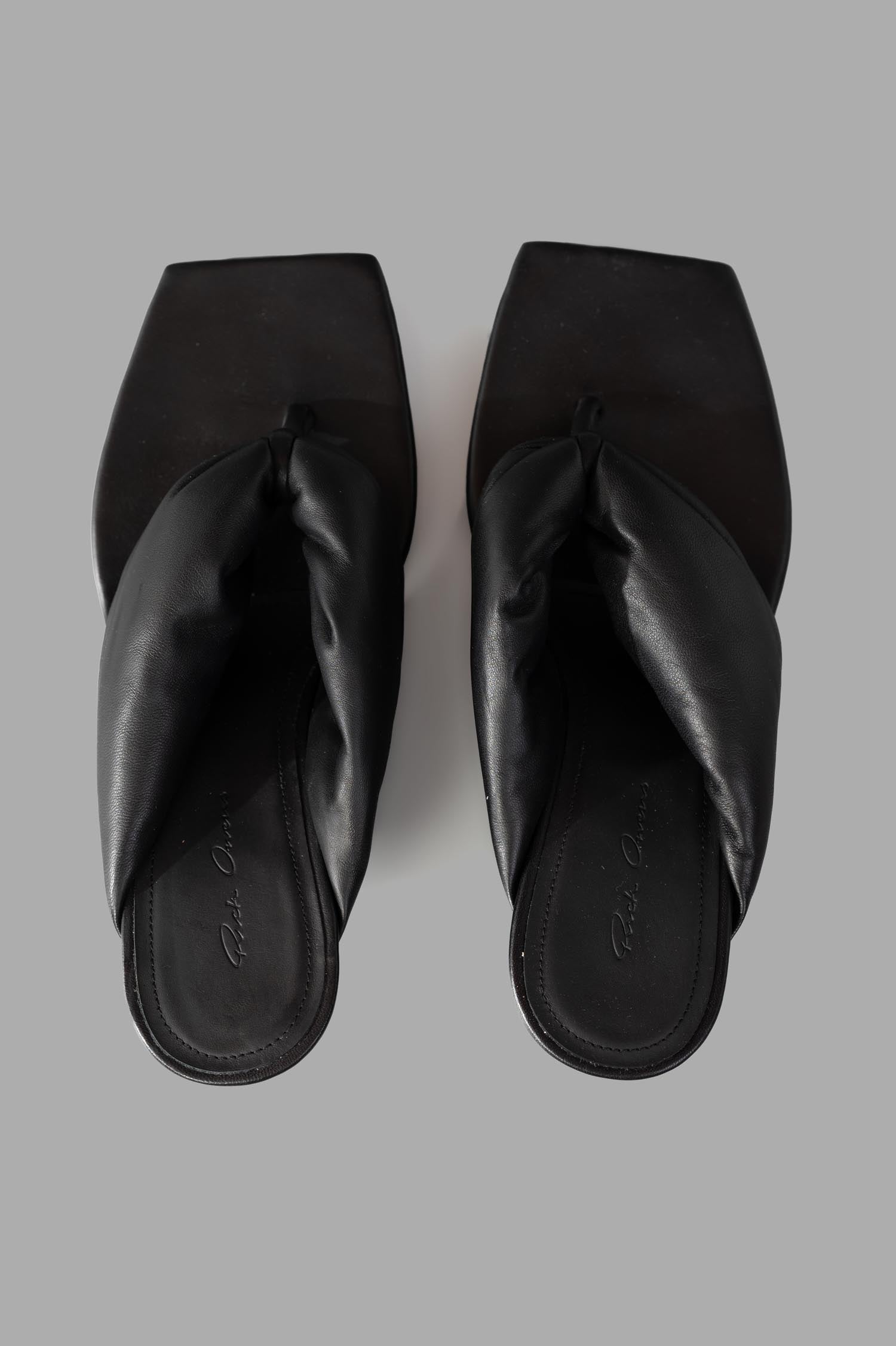 Rick Owens Hollywood Thong Cantilever sandals viewed from above, showcasing black leather straps and square toe design.
