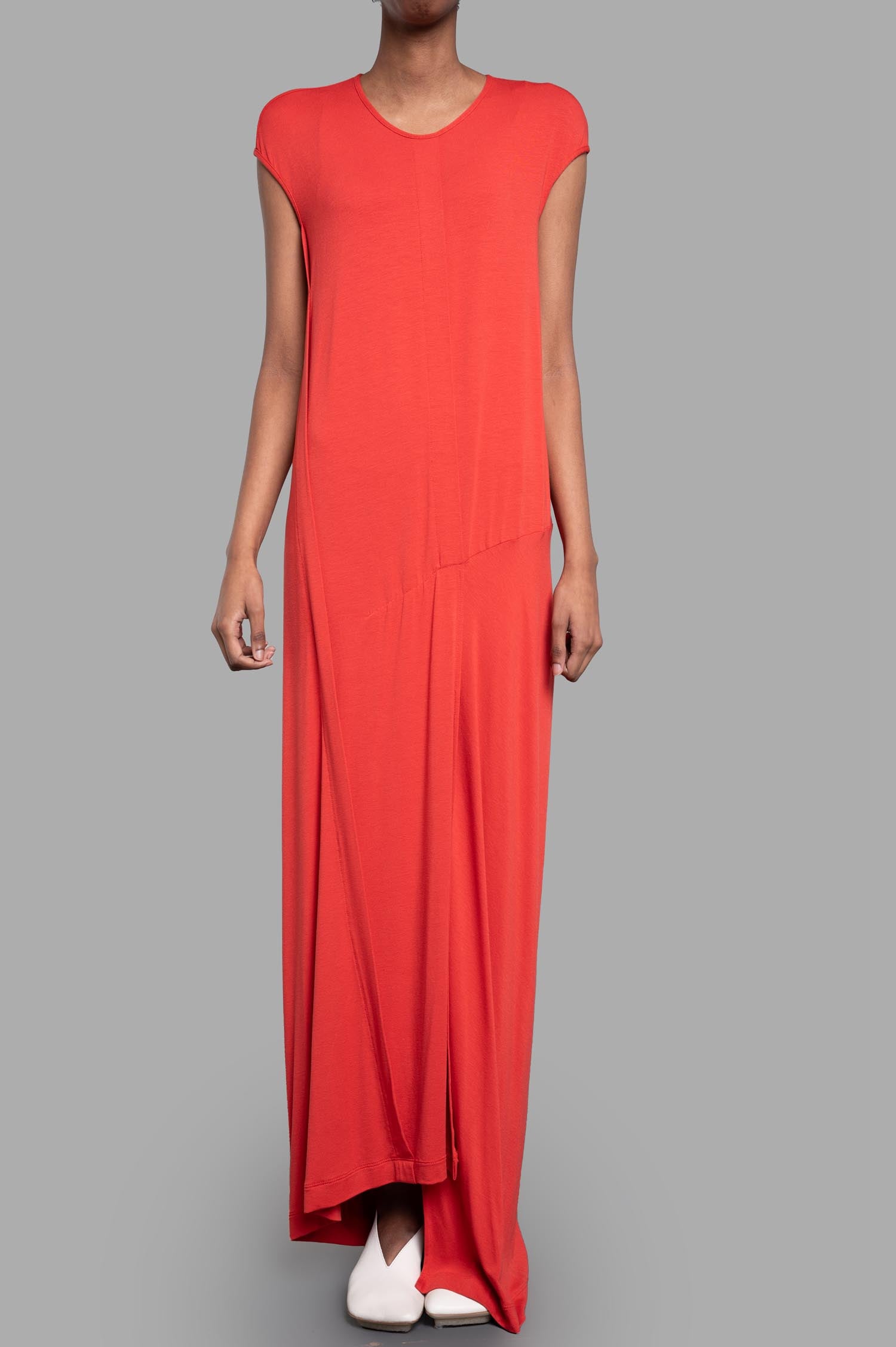 Gentry Portofino Paneled Column Dress in coral, featuring a relaxed fit and cap sleeves, shown on a model.