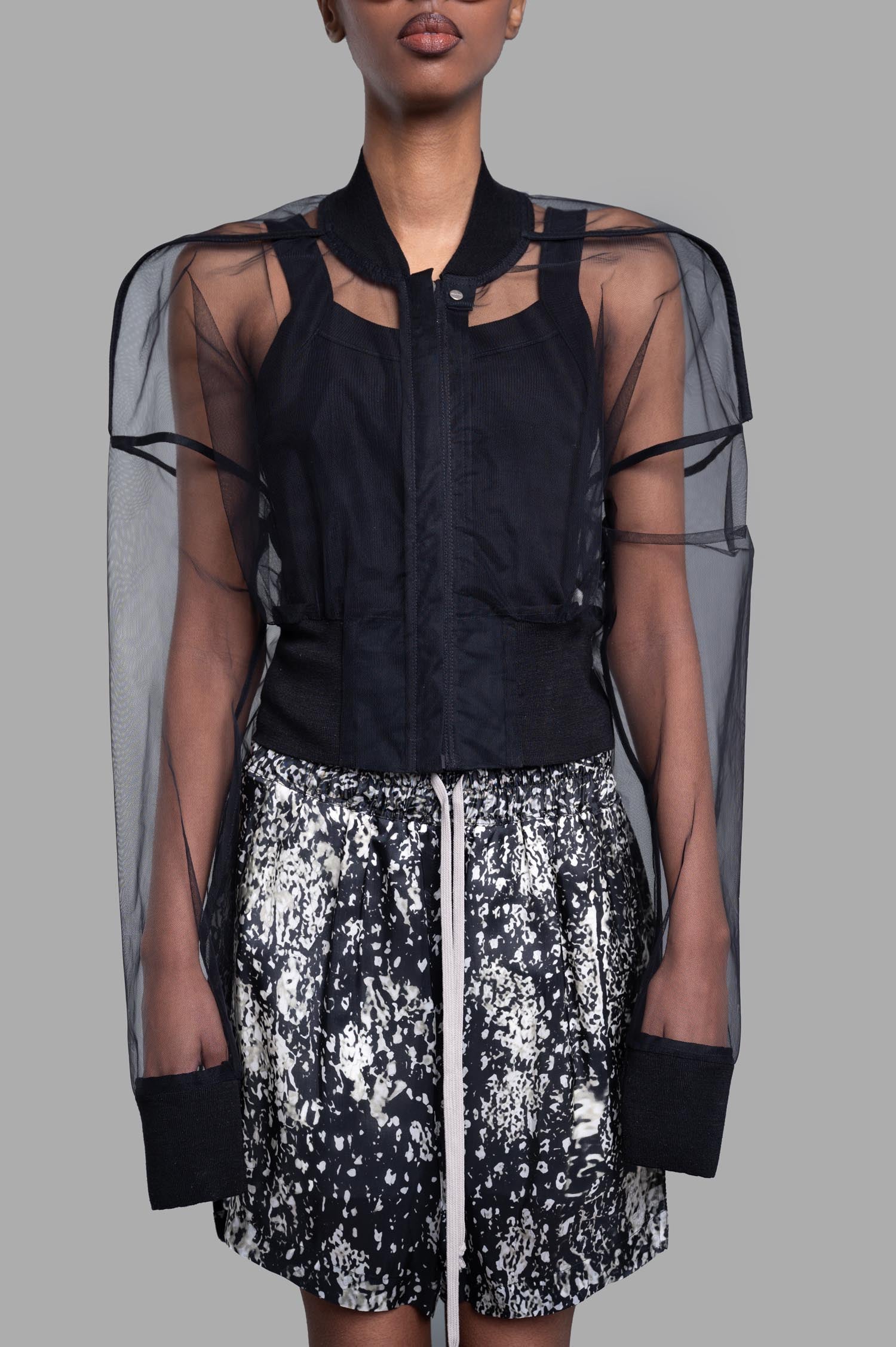 Rick Owens Transparent Cropped Bomber in black, showcasing a daring transparent design and boxy silhouette on model.