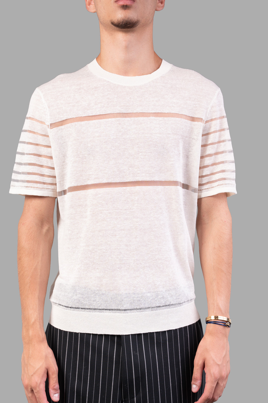 Vivienne Westwood Sheer Stripe Tee in Ivory showcased on model, featuring lightweight linen, crew neck, and sheer stripe.