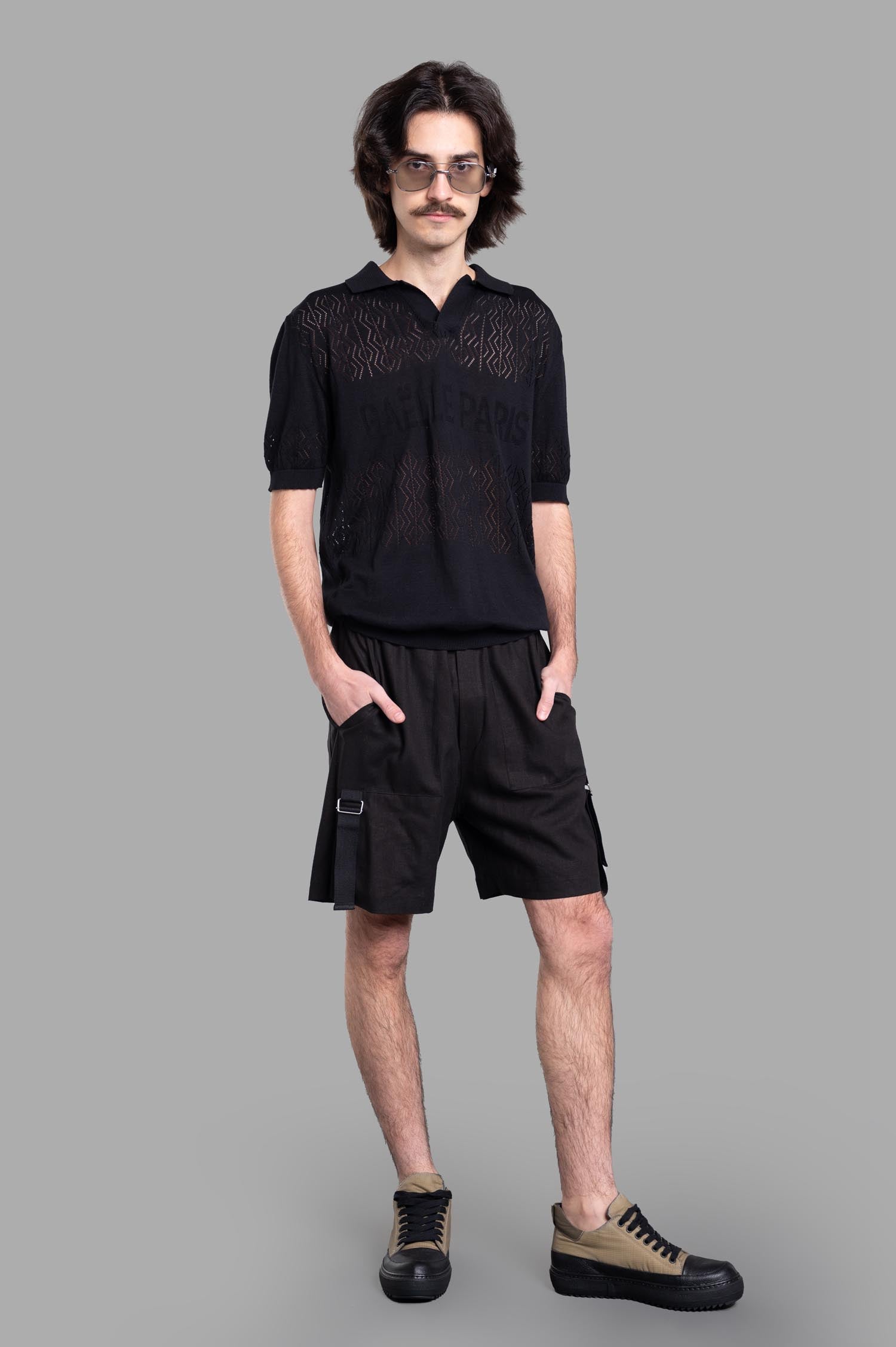 Gaëlle Paris Bermuda Shorts front view on-model, featuring casual black design with side pockets and modern fit.