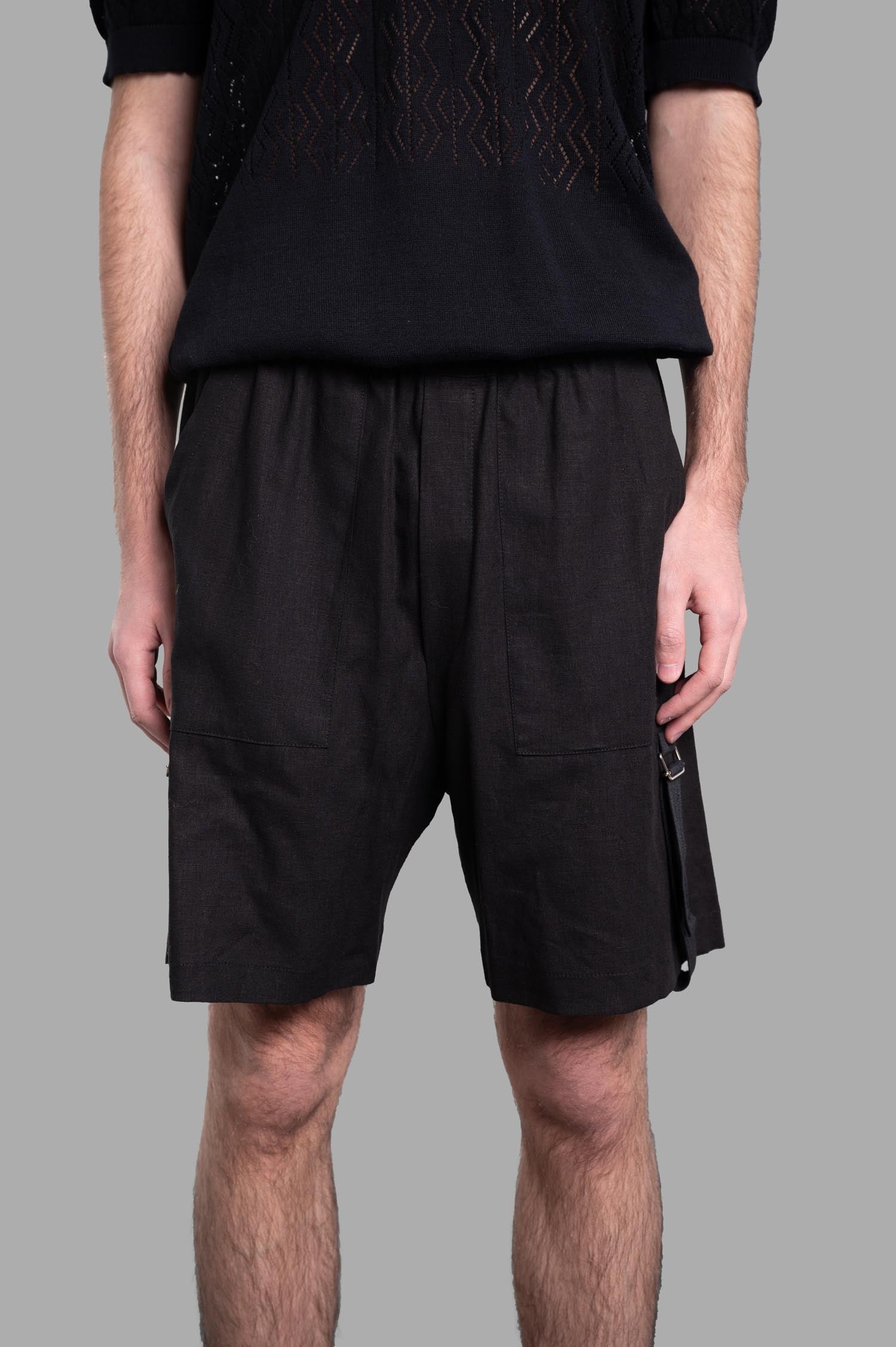Gaëlle Paris Bermuda Shorts displayed on model, featuring a relaxed fit and stylish side detailing. Perfect for summer.