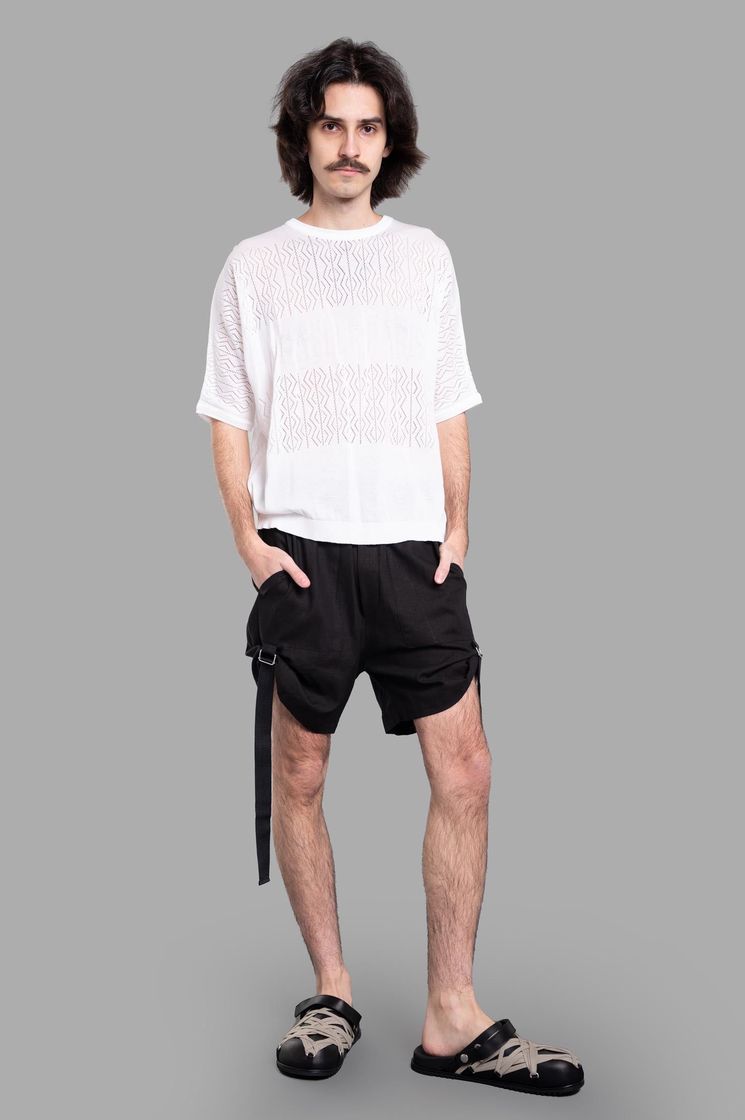 Gaëlle Paris white Knit Logo T-shirt on model, front view, featuring round neckline and brand logo, pure cotton fabric.