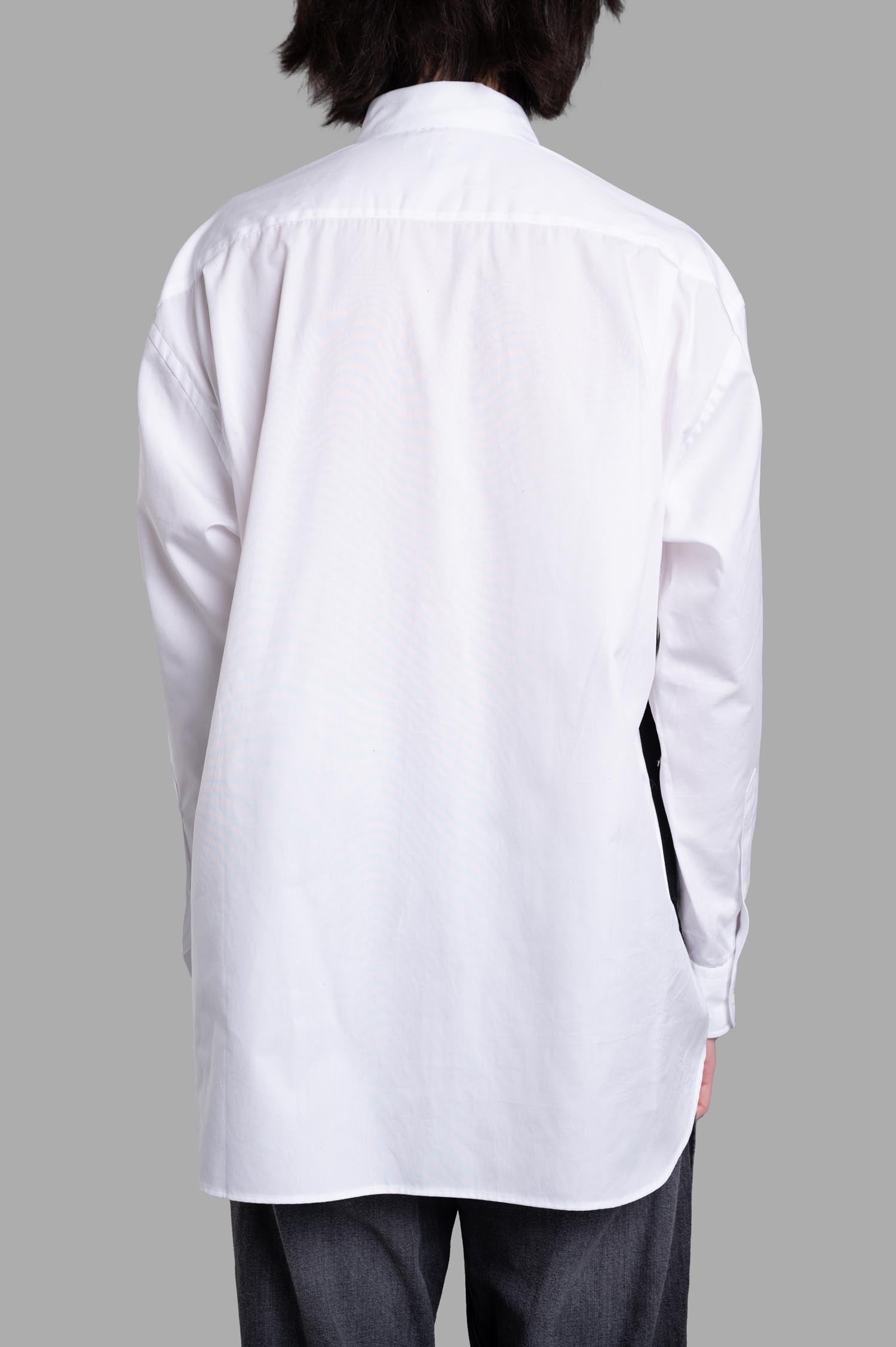 Comme des Garçons Layered Shirt, showcasing the back with a sleek design and black vest detail, crafted from 100% cotton.