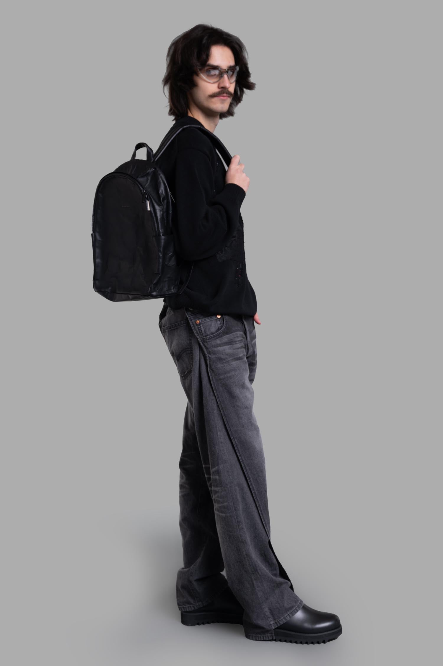 Junya Watanabe x Levi's® Wraparound Jeans in grey, side view on model, showing unique distress detail and relaxed fit.