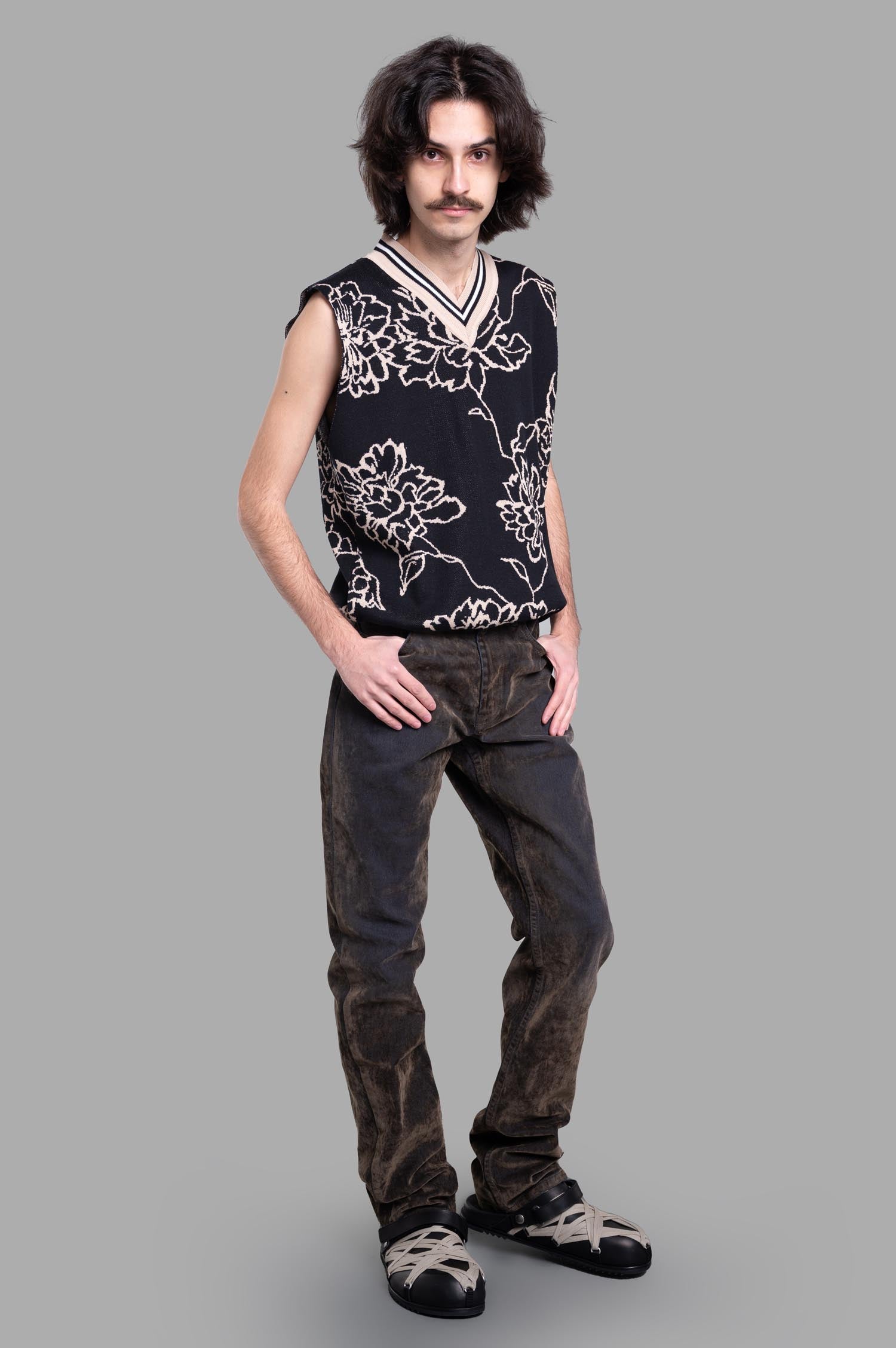 Gaëlle Paris Floral Vest on model, black V-neck sleeveless design with all-over floral print, elevates any ensemble.
