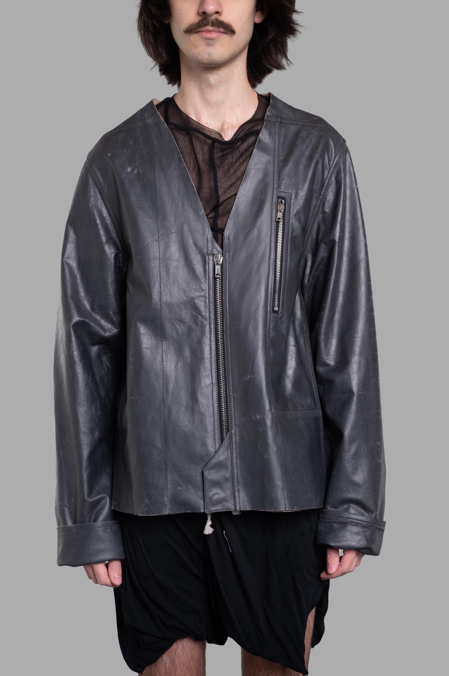 Rick Owens Hollywood V-safety Jacket in black, featuring a V-neck, zip closure, boxy shape, and chest pocket on-model.