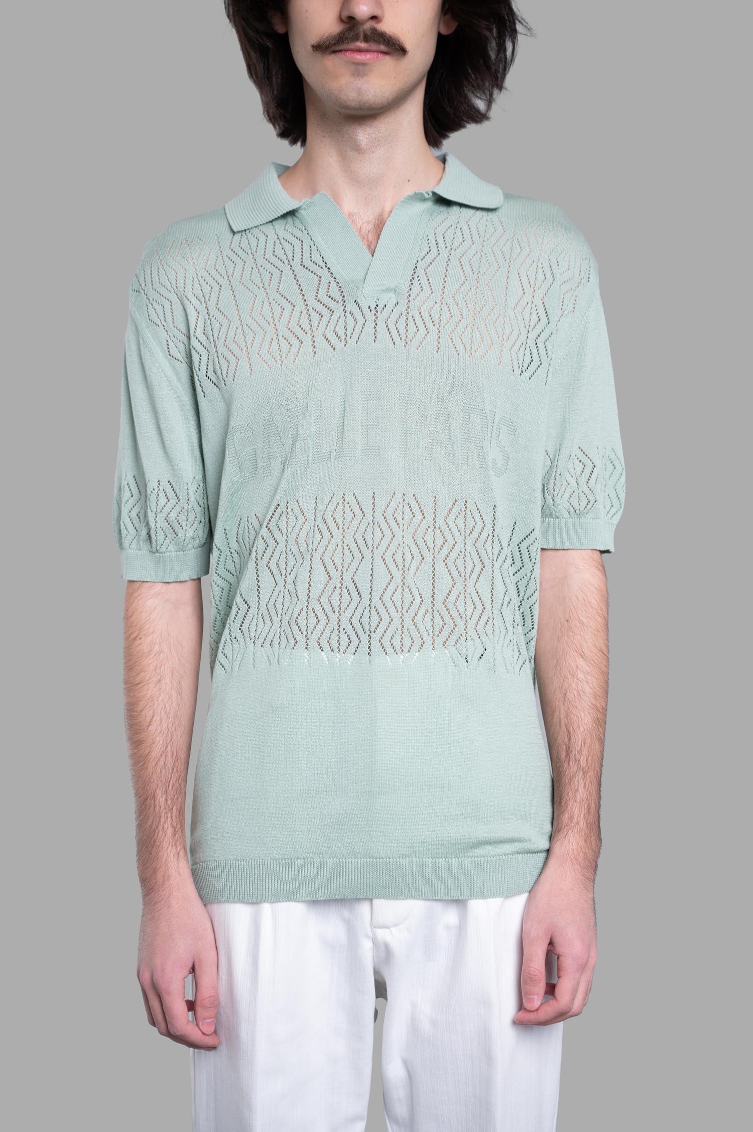 Gaëlle Paris Knit Polo Shirt in mint on model, featuring a classic collar and brand logo with a textured design.