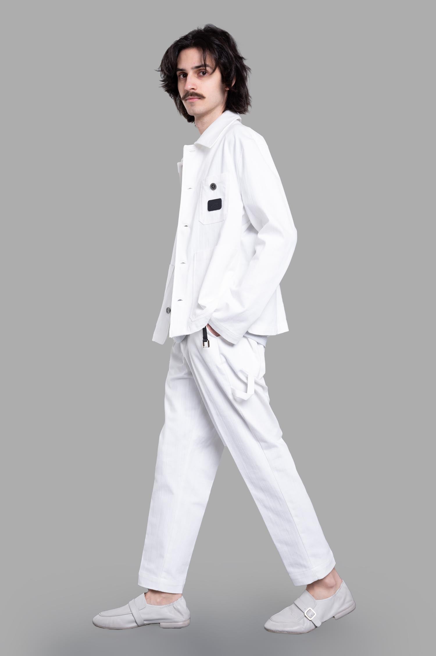 Gaëlle Paris Button-up Jacket, side view on-model, showcasing front pocket and button details.