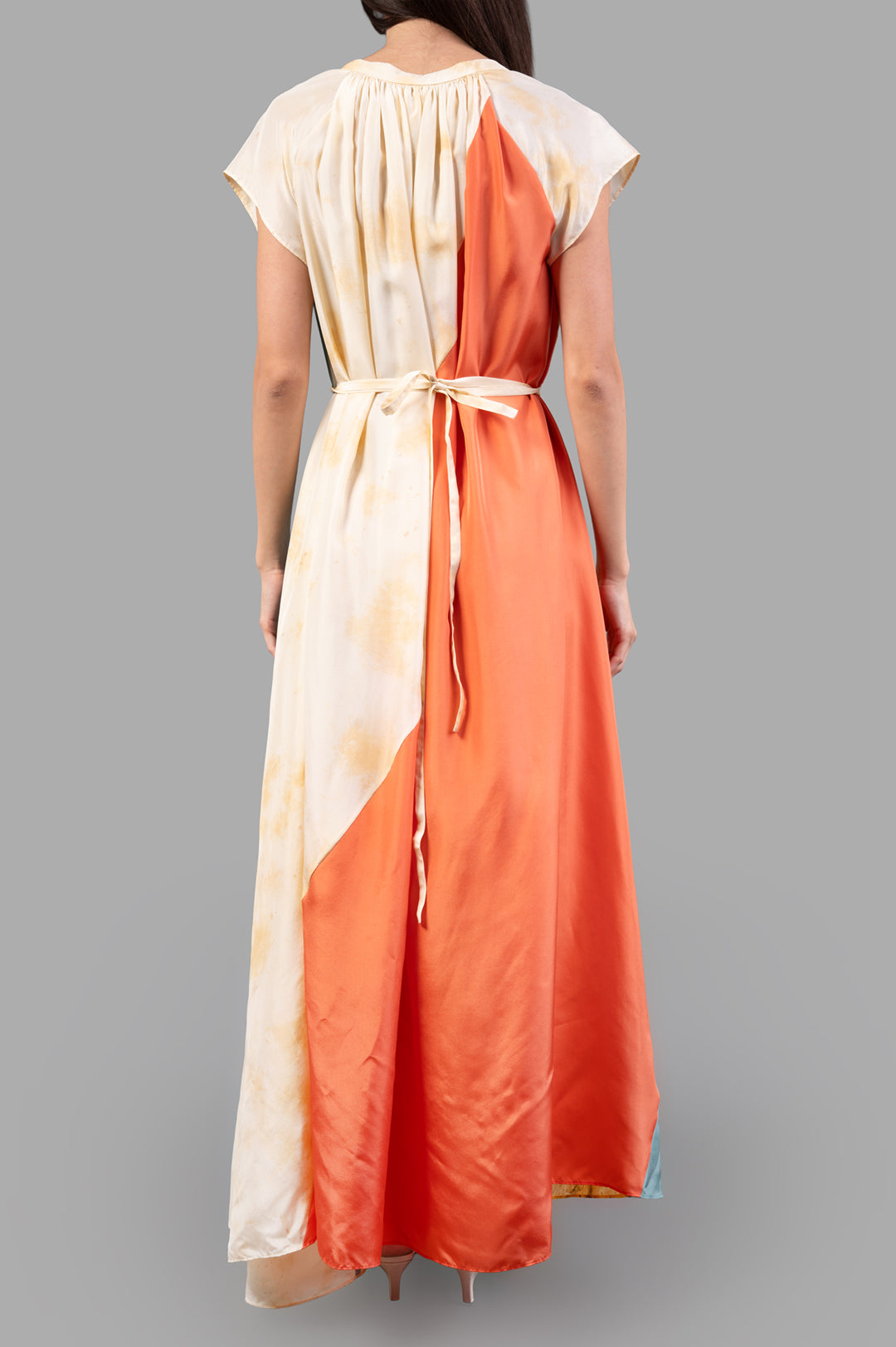 Joseph Silk Tulipa Maxi Dress showcases a colorful, smooth silk back with gathered detail and a tie at the waist.