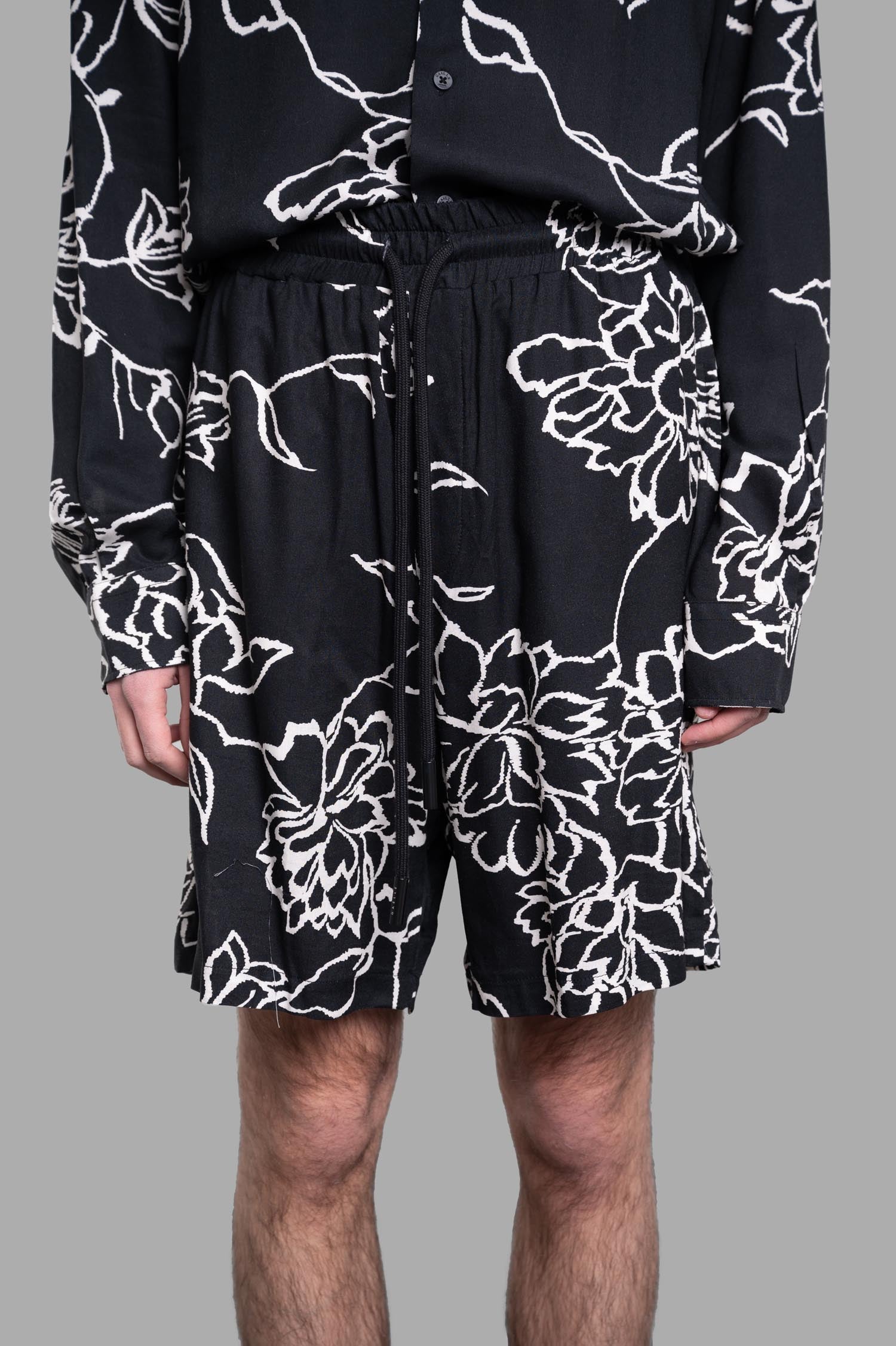 Gaëlle Paris Floral Shorts featuring an elastic waistband, adjustable drawstring, and vibrant floral design.
