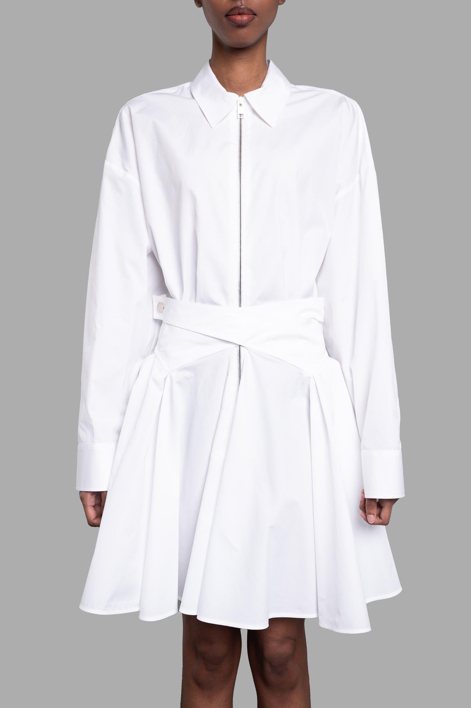 MSGM Tennis Dress in white showcases a front view with classic collar, zipper, and pleated skirt for an elegant look.