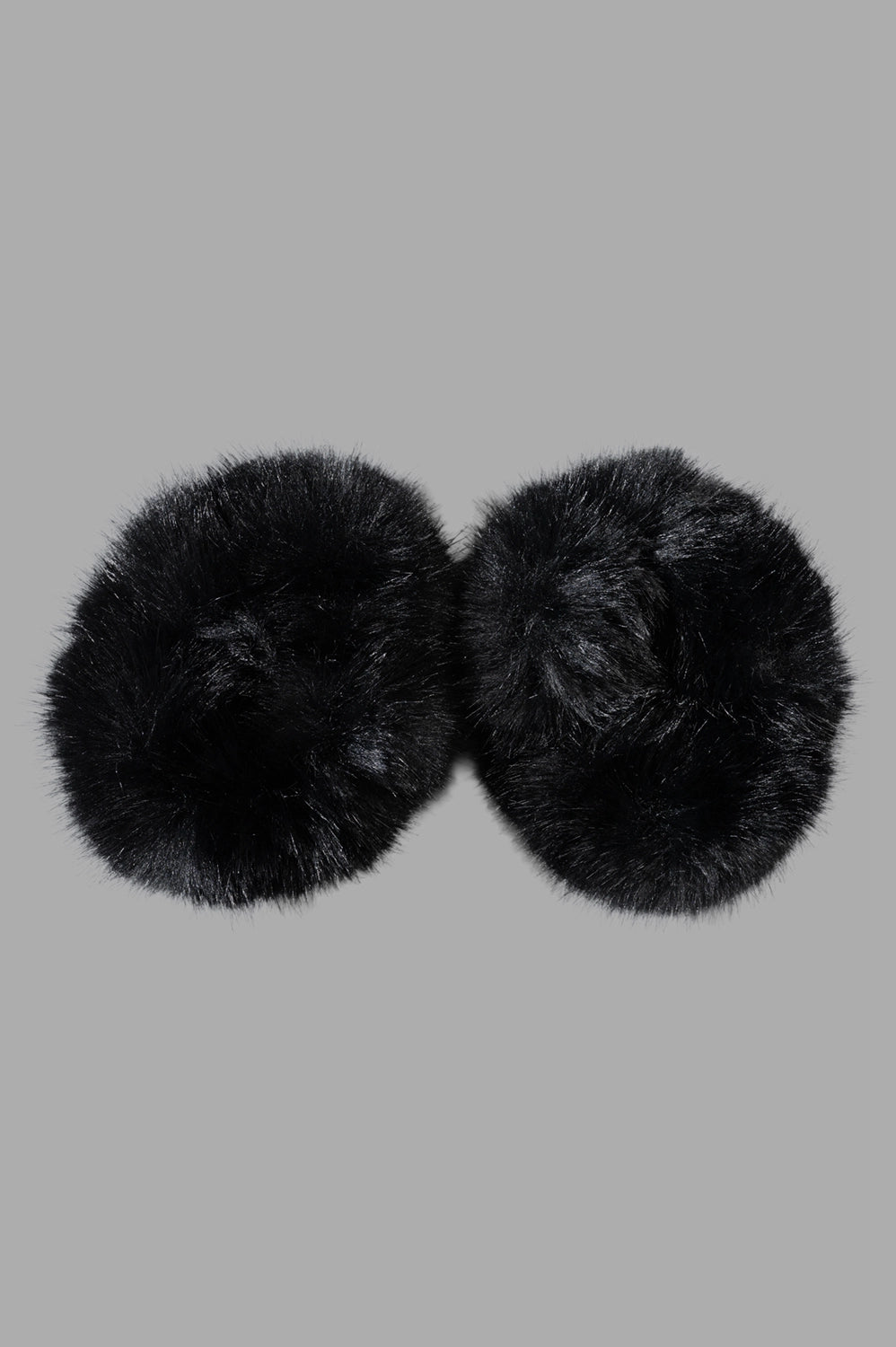 By Malene Birger Elbie Wrist Cuffs, black faux fur, fluffy texture, close-up detail, polished finish.