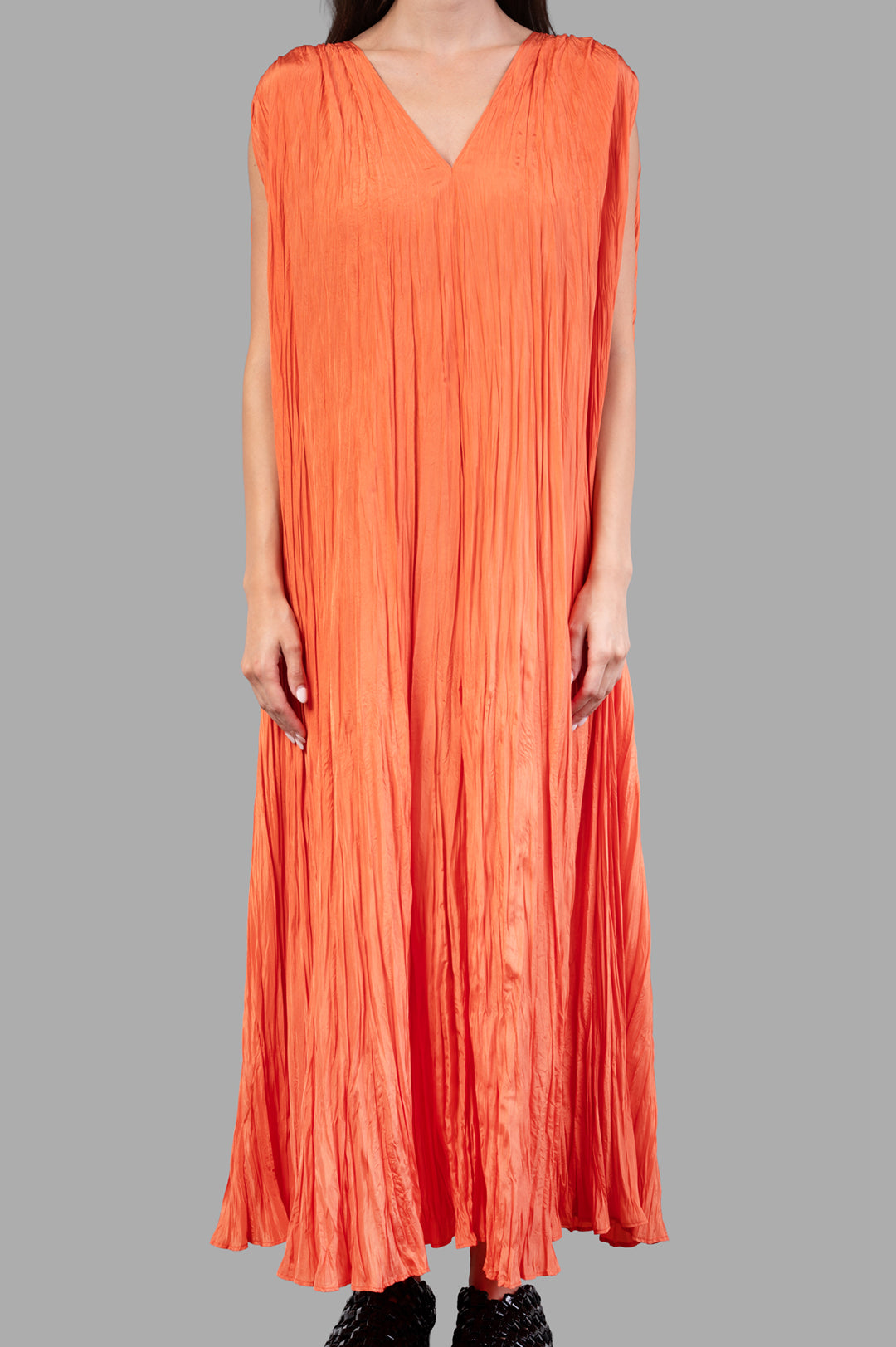 Joseph. Habotai Silk Dress in orange, showcasing a relaxed fit and crinkled texture, styled with a tie belt at the waist.