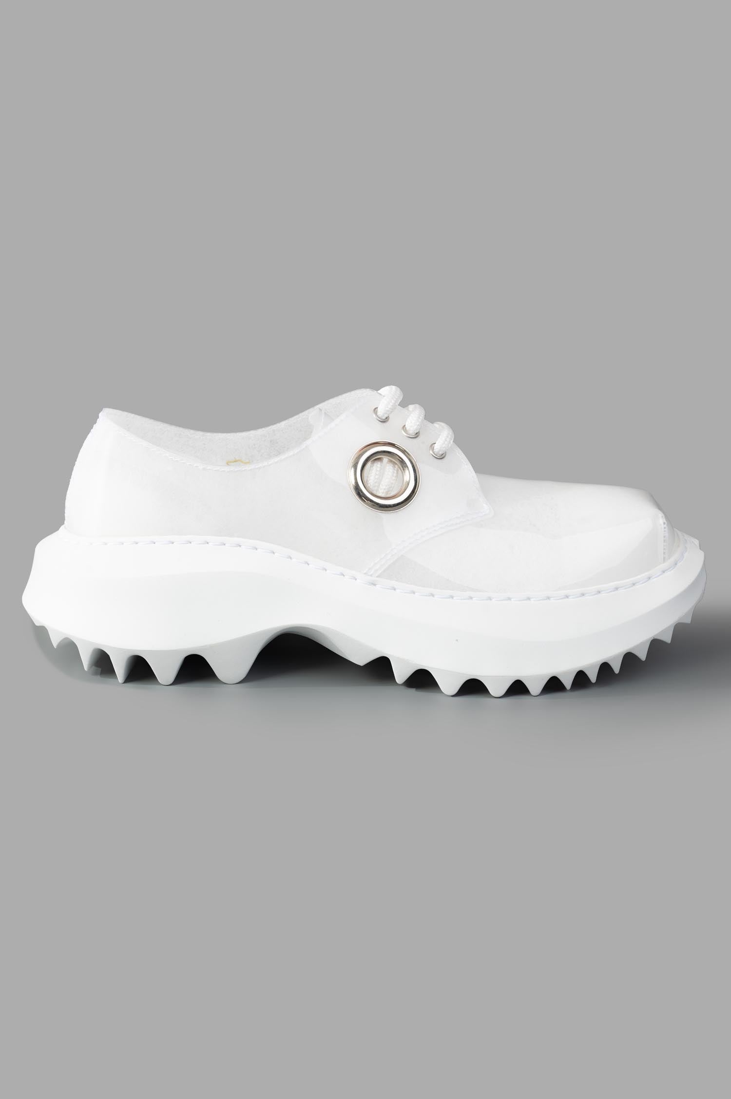Comme des Garçons x Phileo 062 Derby Shoes side view, white rubber, unique design with metal eyelet embellishment.