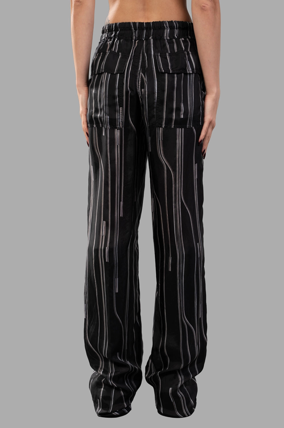 Rick Owens Dietrich Drawstring Trousers in Black/Pearl displayed from the back, featuring a relaxed fit and vertical stripe design.