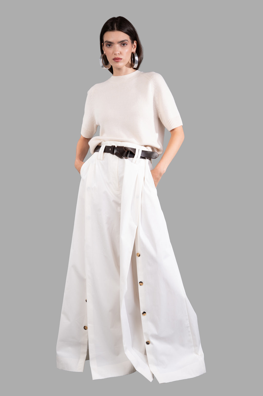 A.W.A.K.E. MODE Split Cotton-poplin Trousers, front view on model, showcasing button-fastening splits and detachable belt.