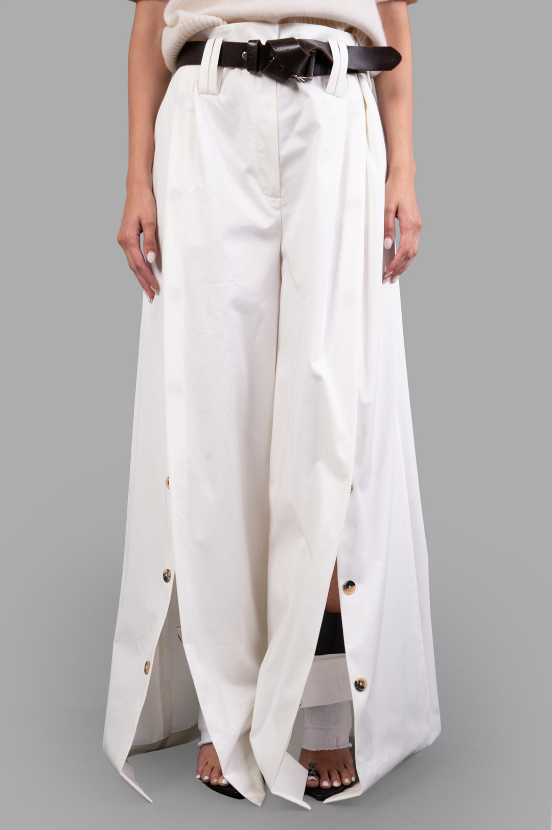A.W.A.K.E. MODE Split Cotton-poplin Trousers in white with button-fastening splits and detachable belt detail on model.
