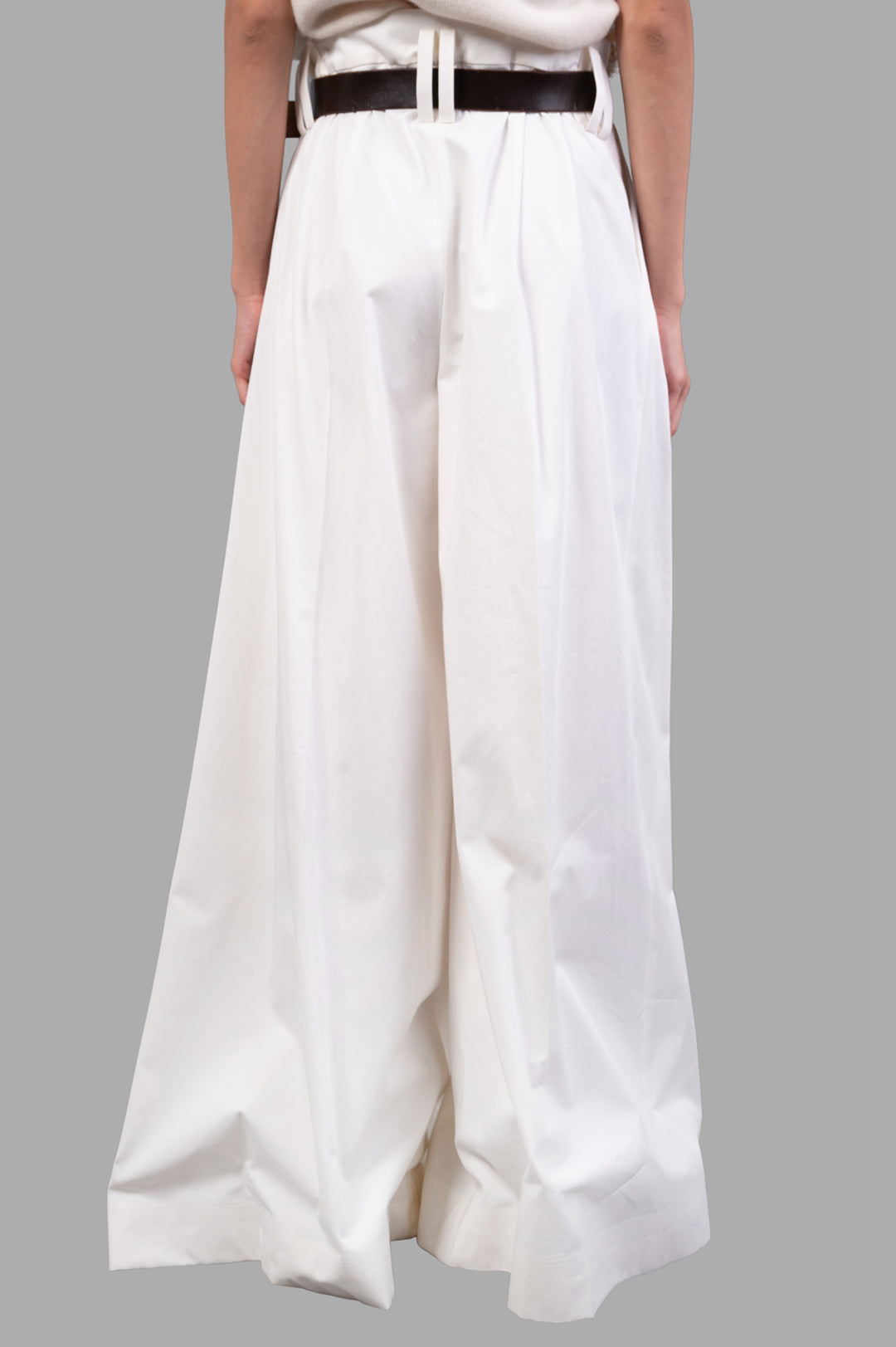 A.W.A.K.E. MODE Split Cotton-poplin Trousers in white, showcasing the pleated waist and adjustable belt from the back.