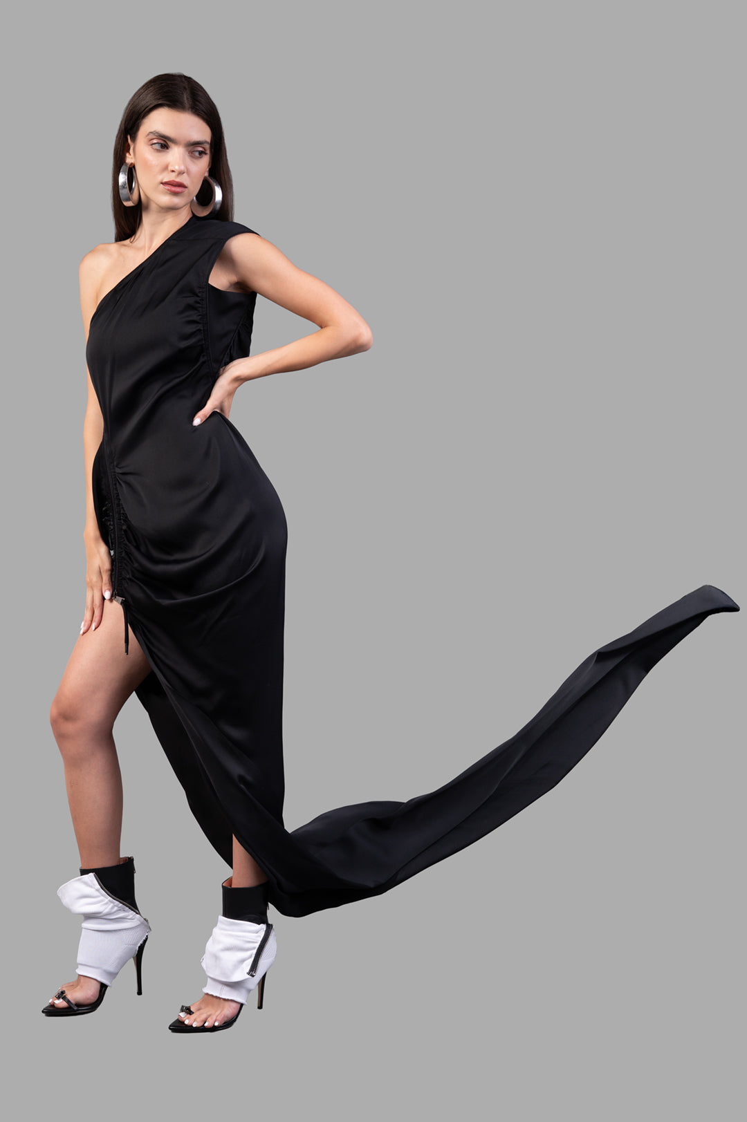 Vivienne Westwood Andreas One-shoulder Dress, side view on model, black gown with long train and stylish accessories.