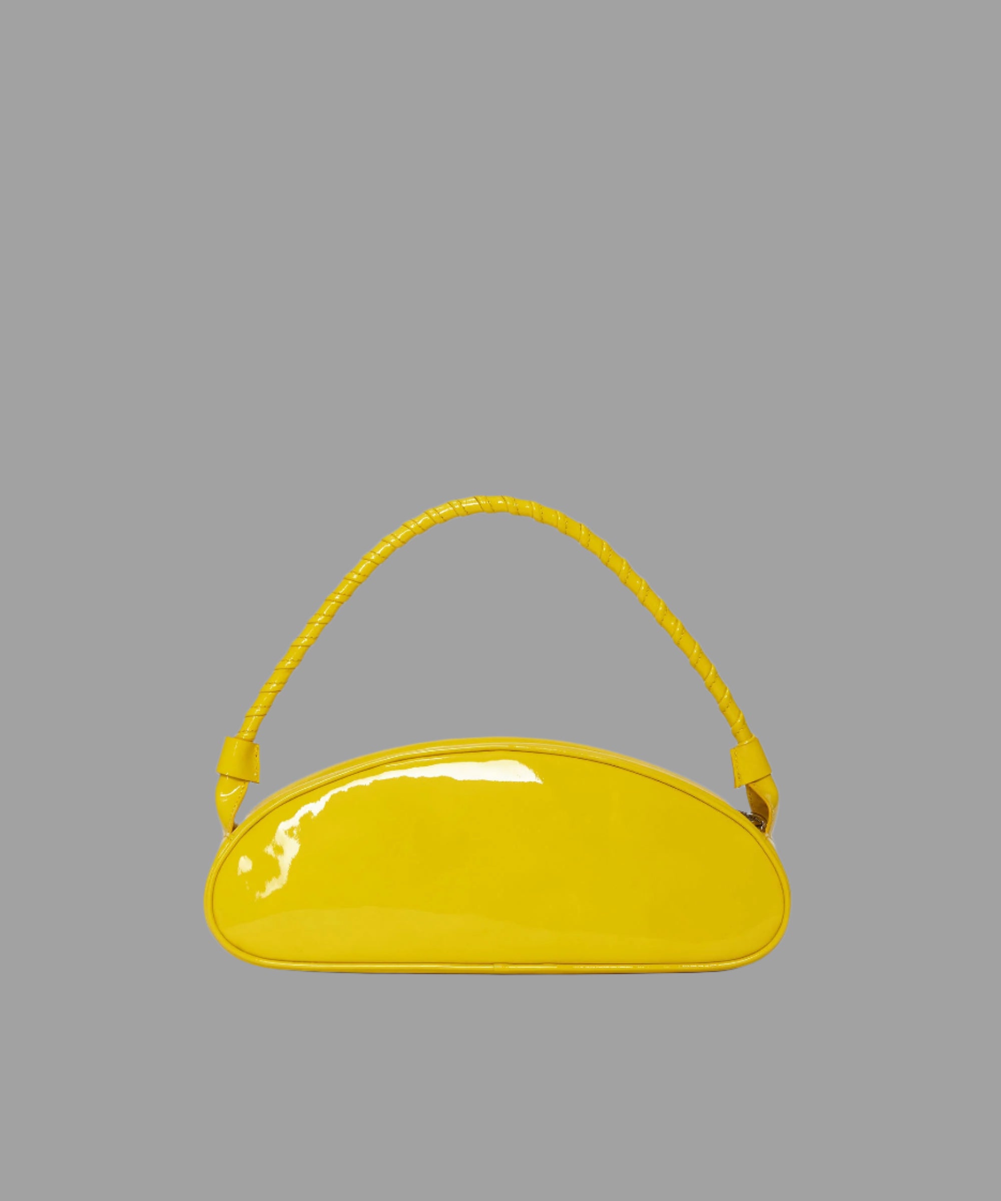 MSGM yellow patent leather handbag with braided handle, front view. Stylish design, embossed logo, zipper closure for.