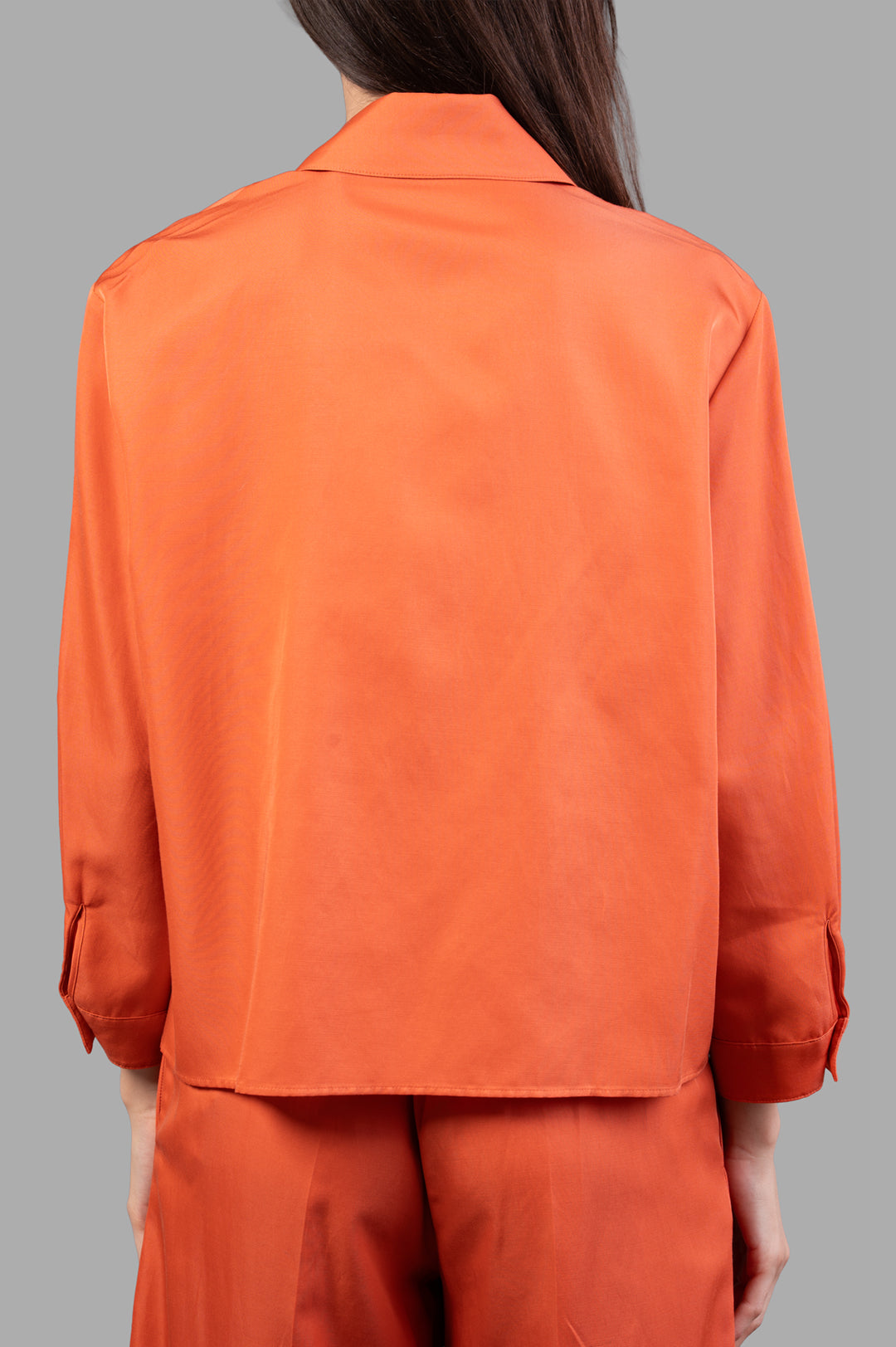 Joseph Soft Cotton Silk Shirt in burnt orange, showcasing a back view with a relaxed cropped fit and tailored collar.