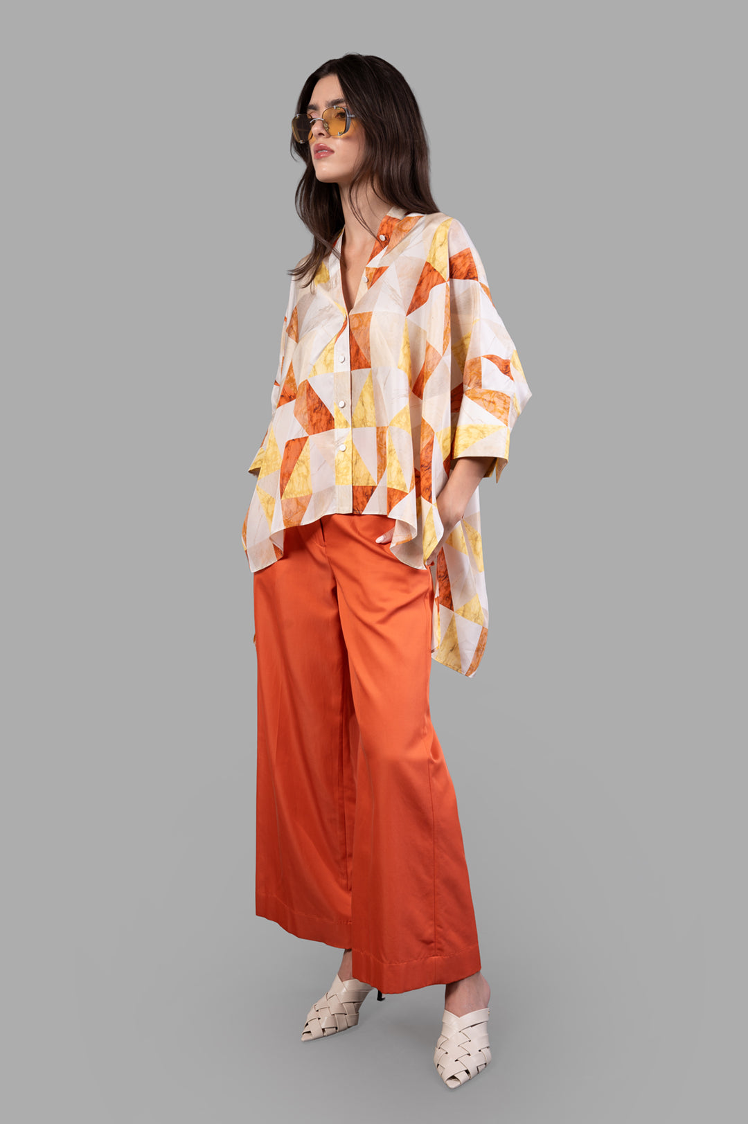 Joseph Arcole Marble-print Silk Shirt, front view on model, geometric pattern with orange wide-leg pants.