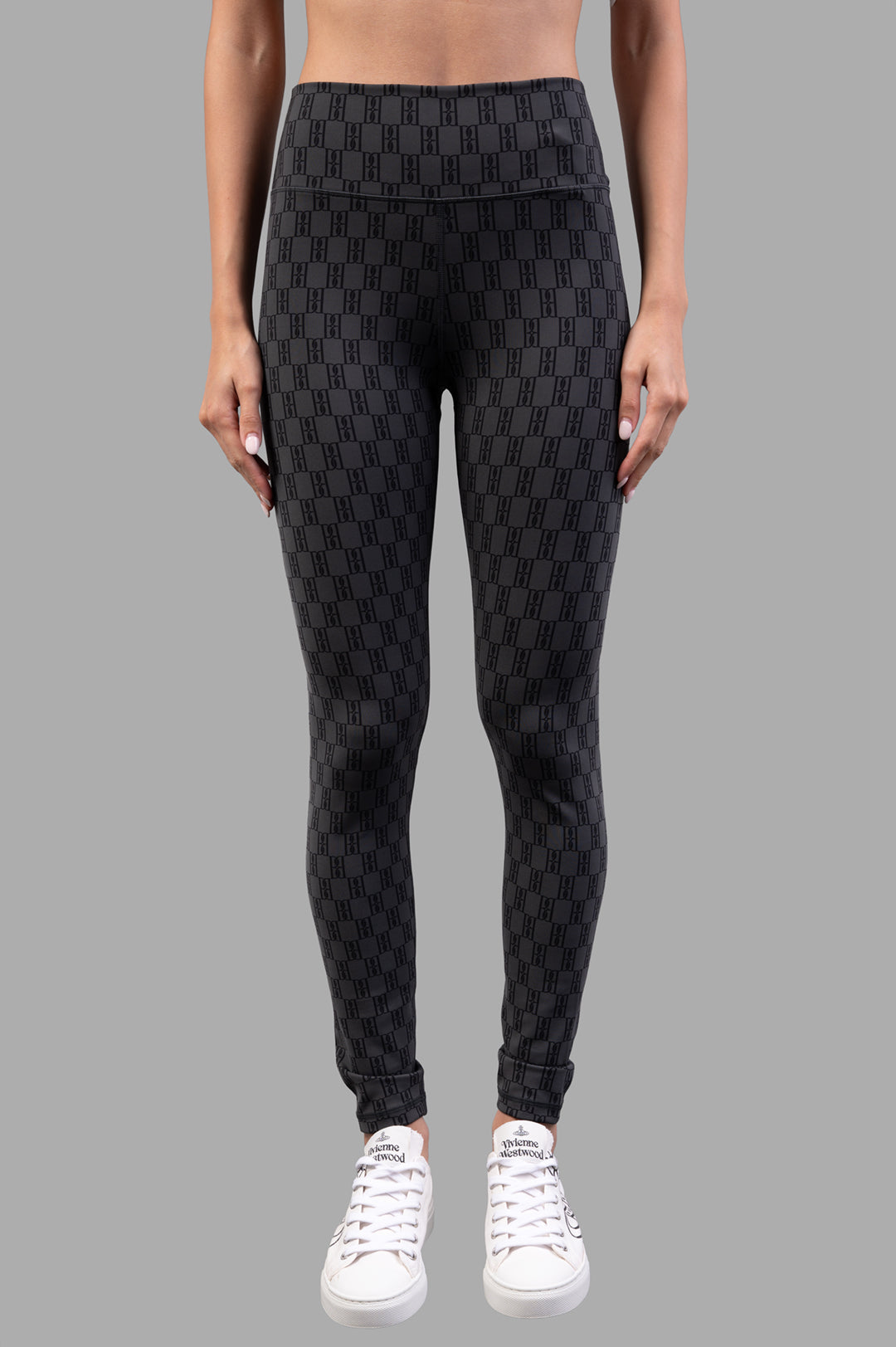 By Malene Birger Polene Athletic Leggings in black & grey, featuring a wide elastic band and monogram design, front view on.