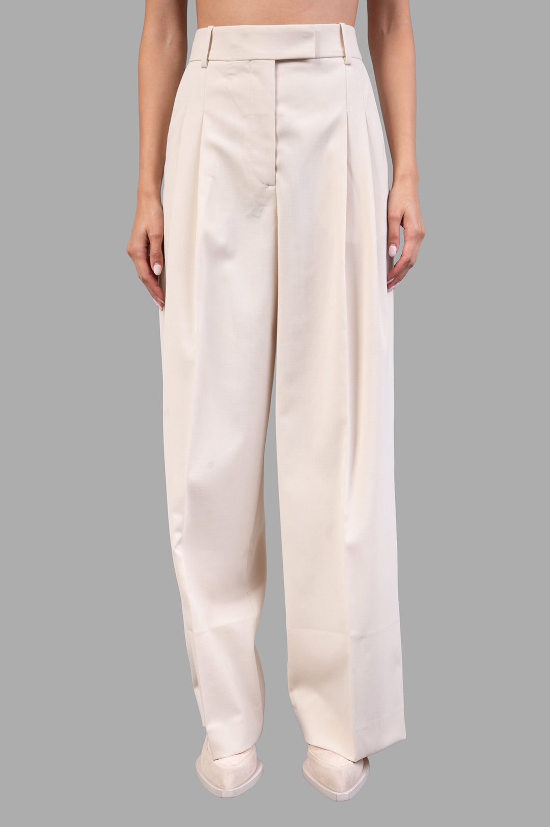 By Malene Birger Cymbaria High-waist Trousers in pearl, featuring sharp pleats and wide legs for a stylish, tailored look.