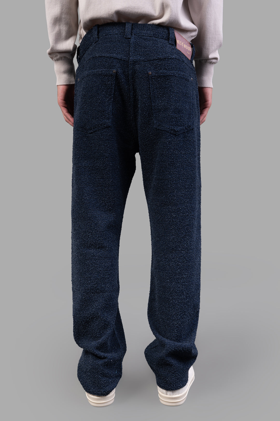 Vivienne Westwood Ranch Bouclé Wool Jeans showcased from the back, featuring textured wool and a branded jacron patch.