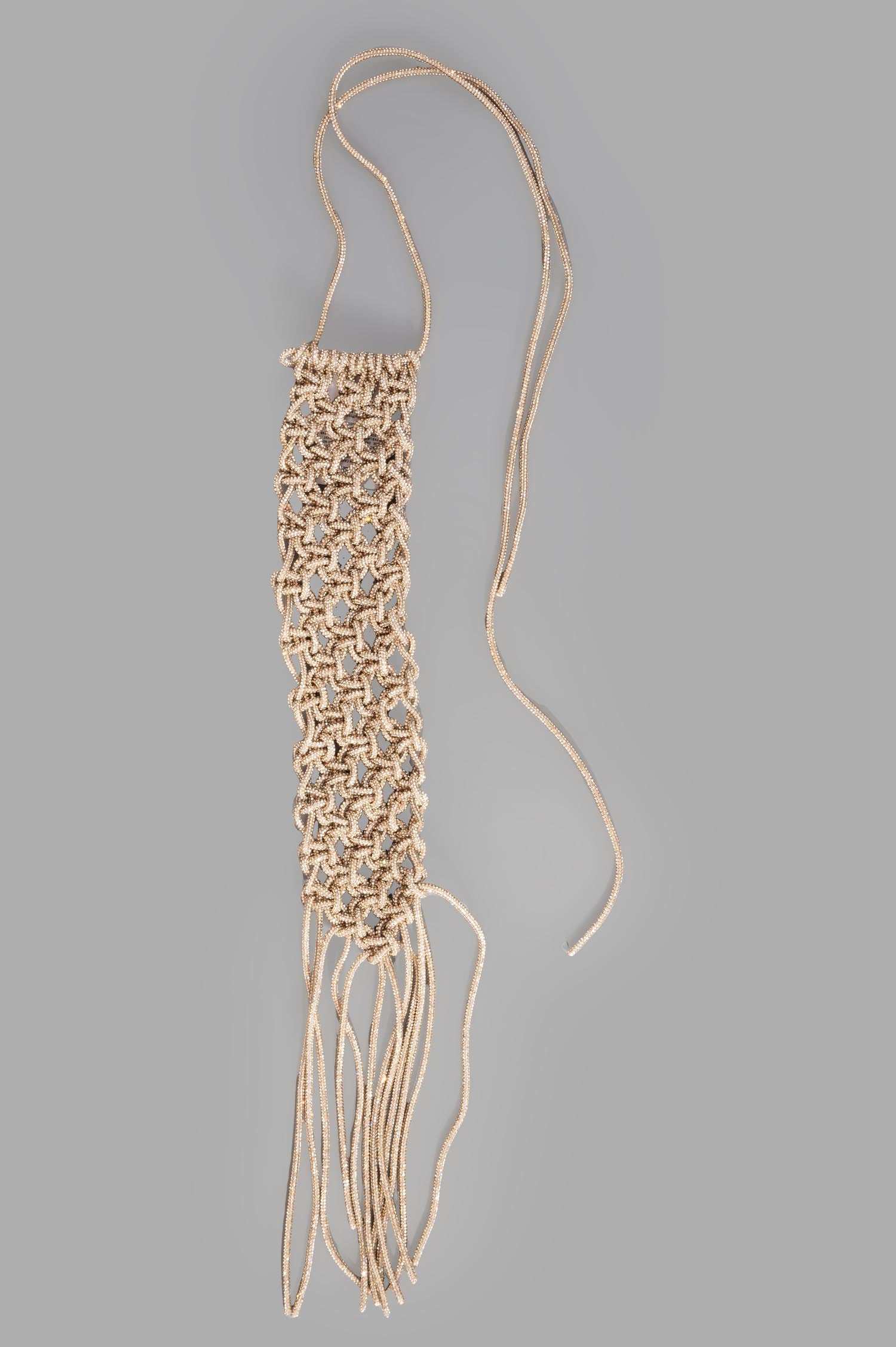 Gentry Portofino Gold Macrame Necklace, detailed view showcasing intricate glitter rope design and elegant tassels.